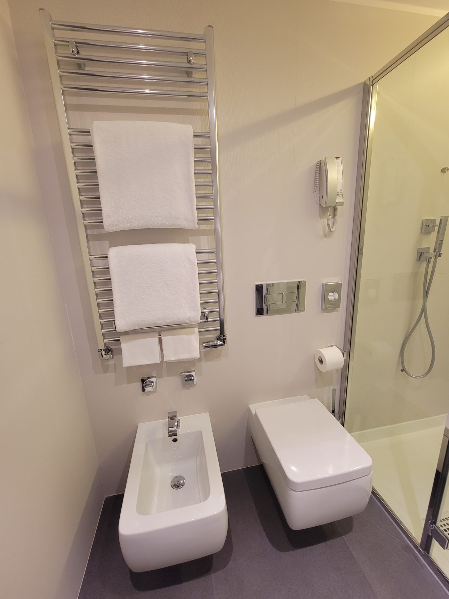 a bathroom with a shower and toilet