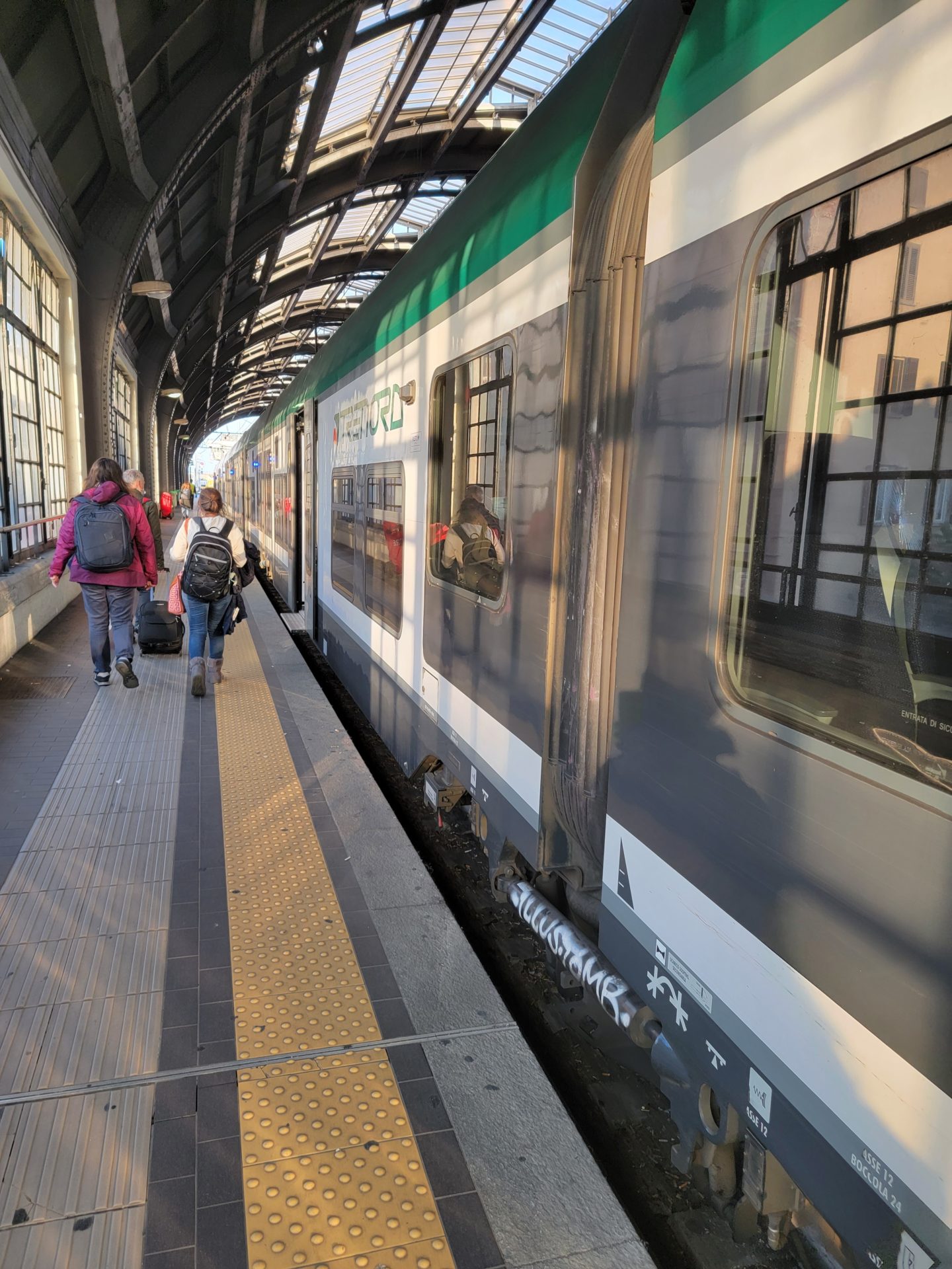 people walking on a train platform