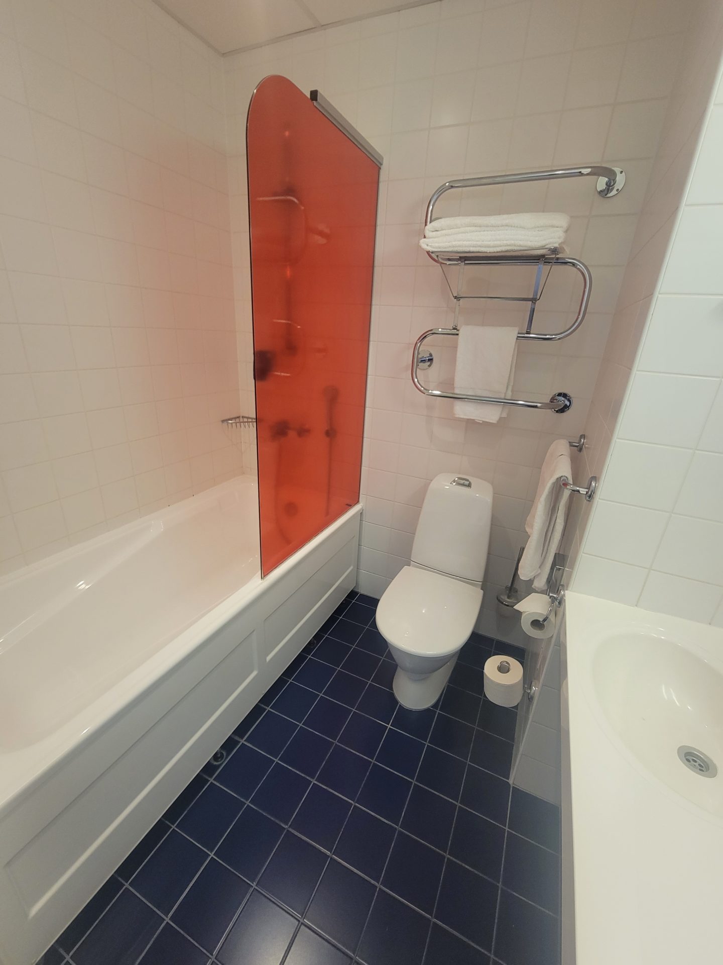 a bathroom with a bathtub and toilet