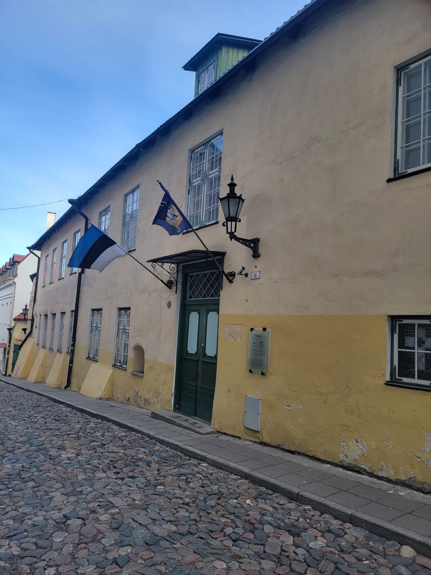 a building with flags on the side of it