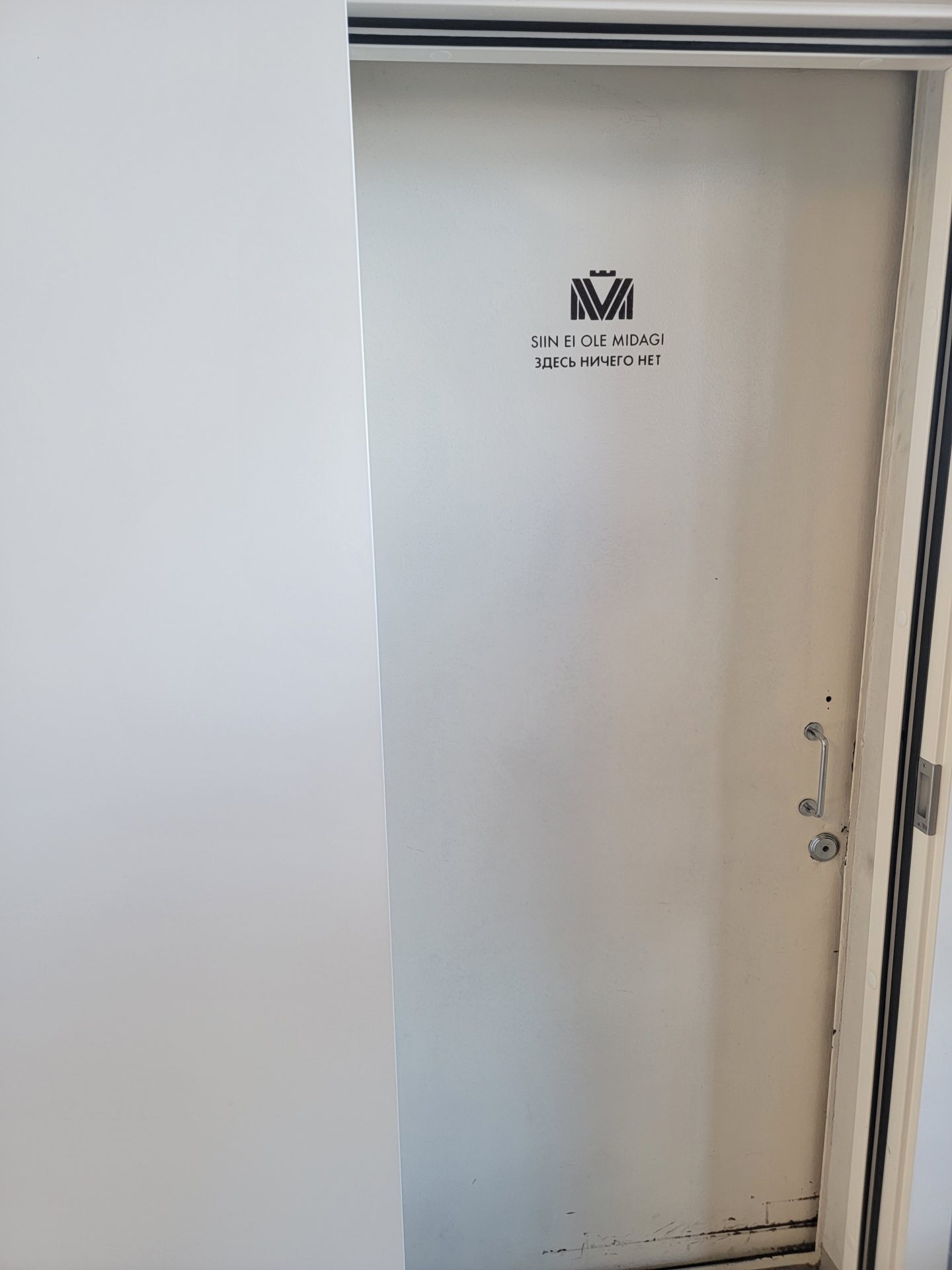 a white door with a logo on it