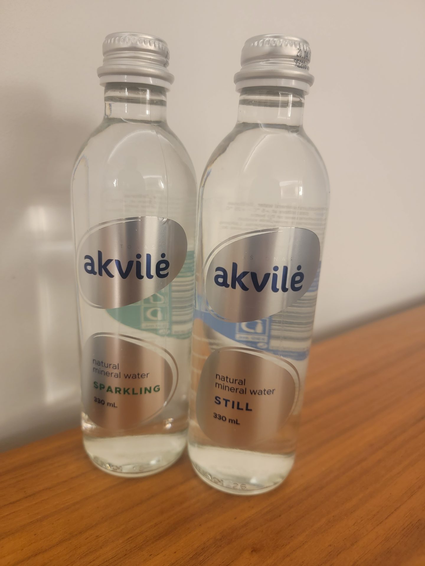two bottles of water on a table