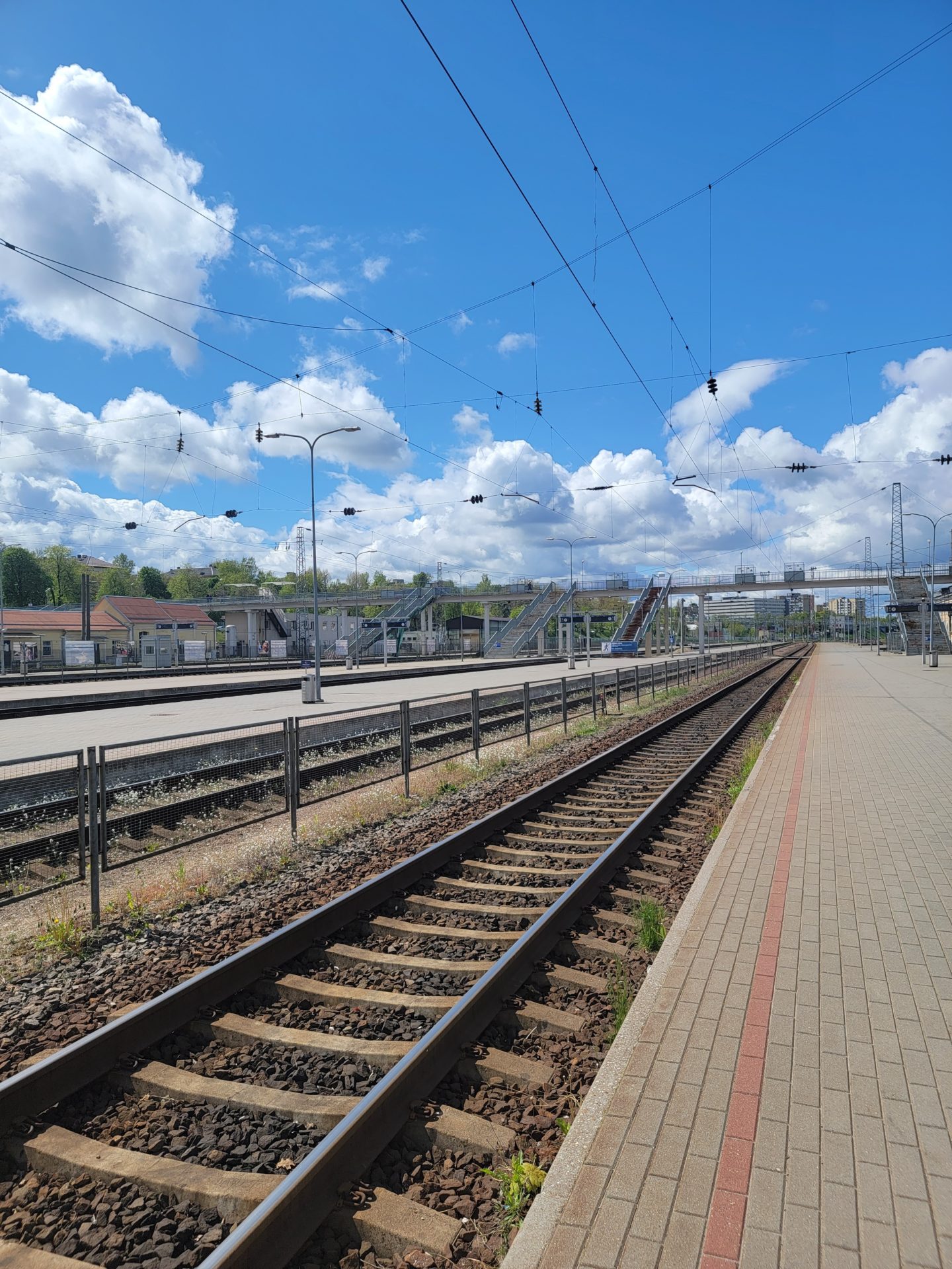 train tracks next to a platform