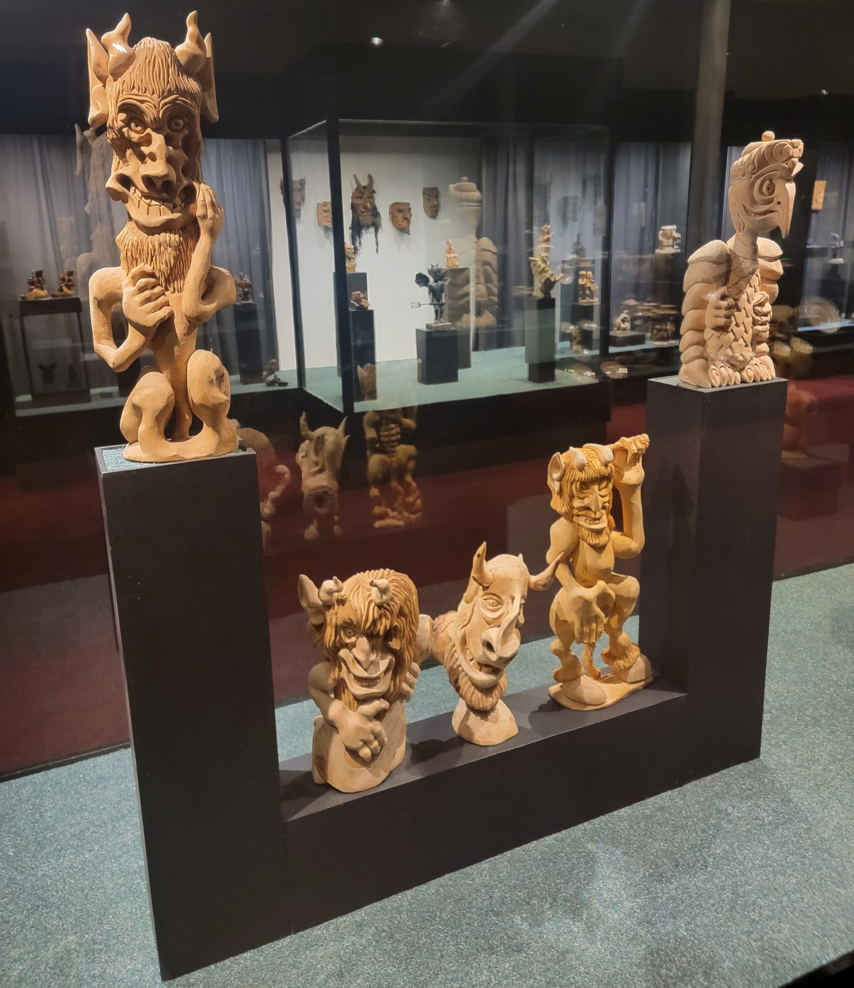 a group of carved wooden statues