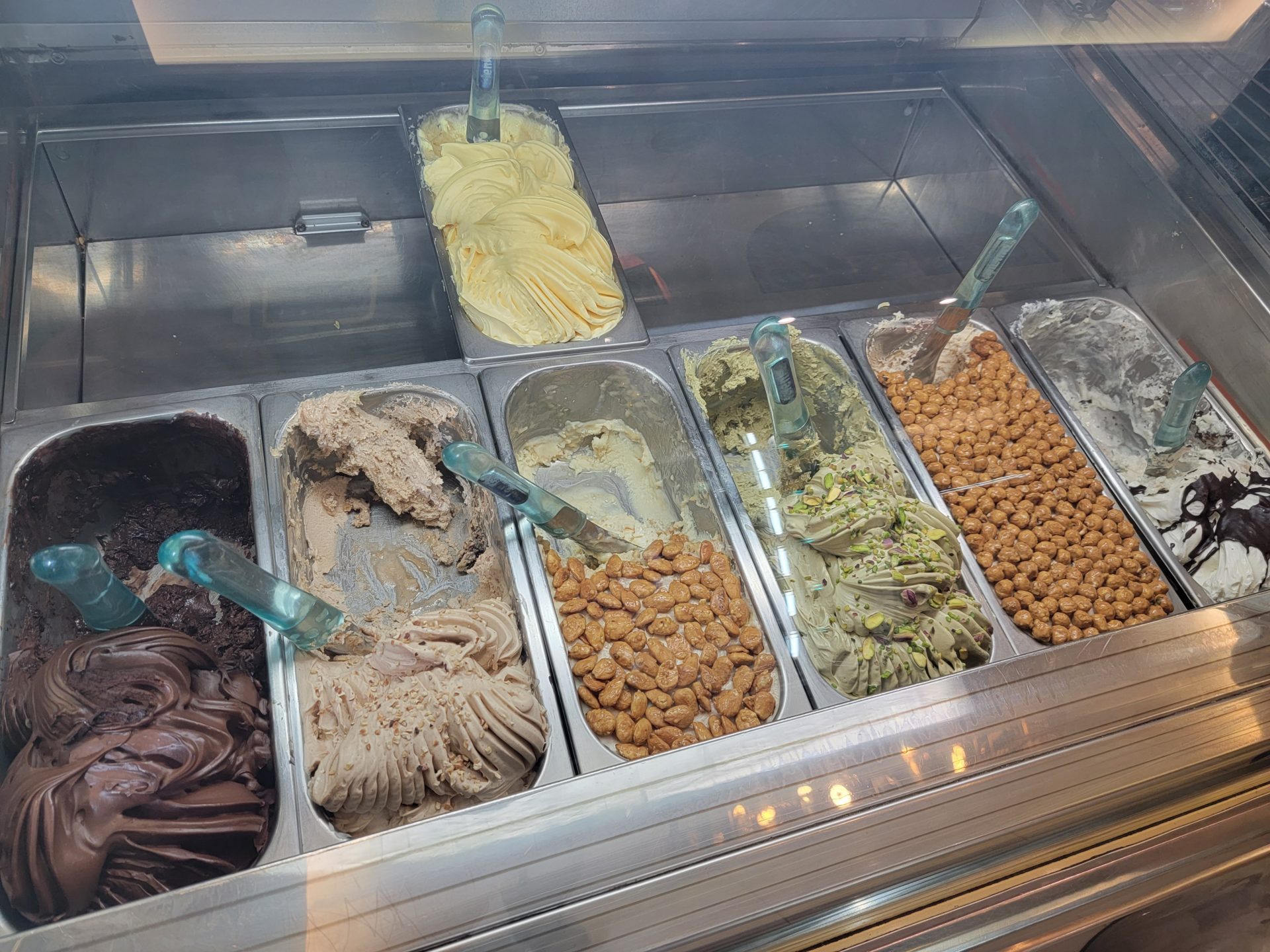 a trays of ice cream in a display case