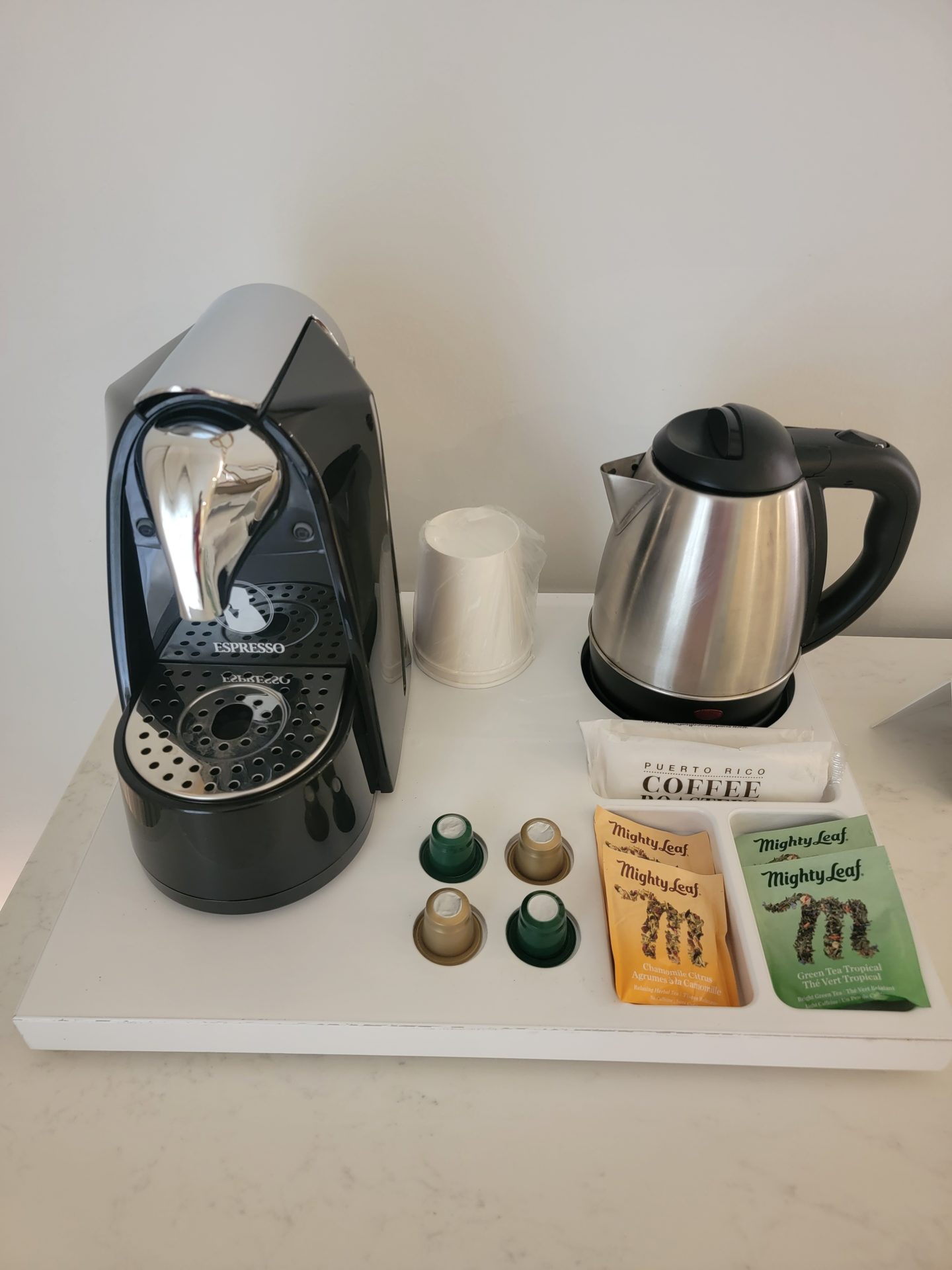 a coffee maker and coffee pot on a table