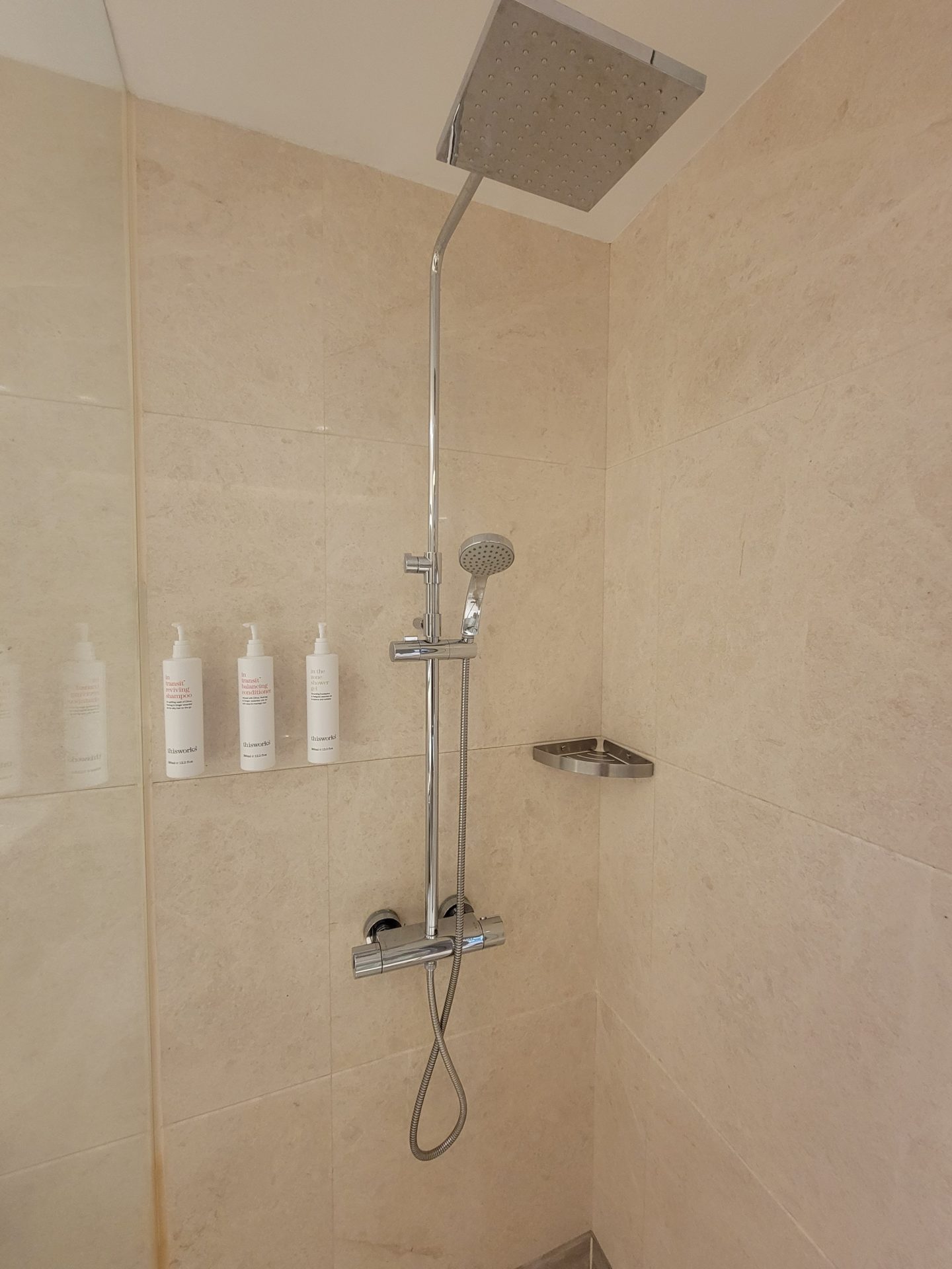 a shower with a shower head and a shower head