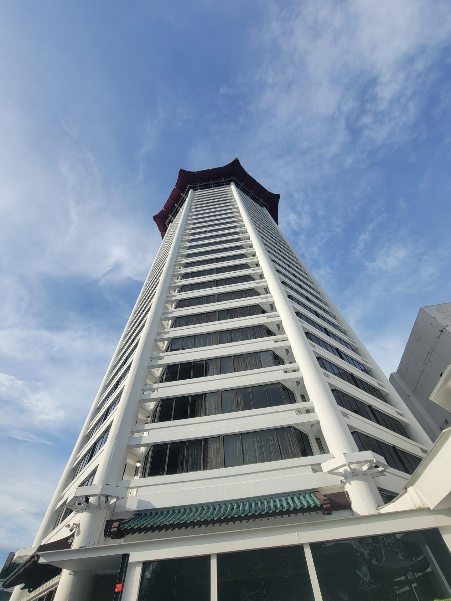 a tall building with a red roof
