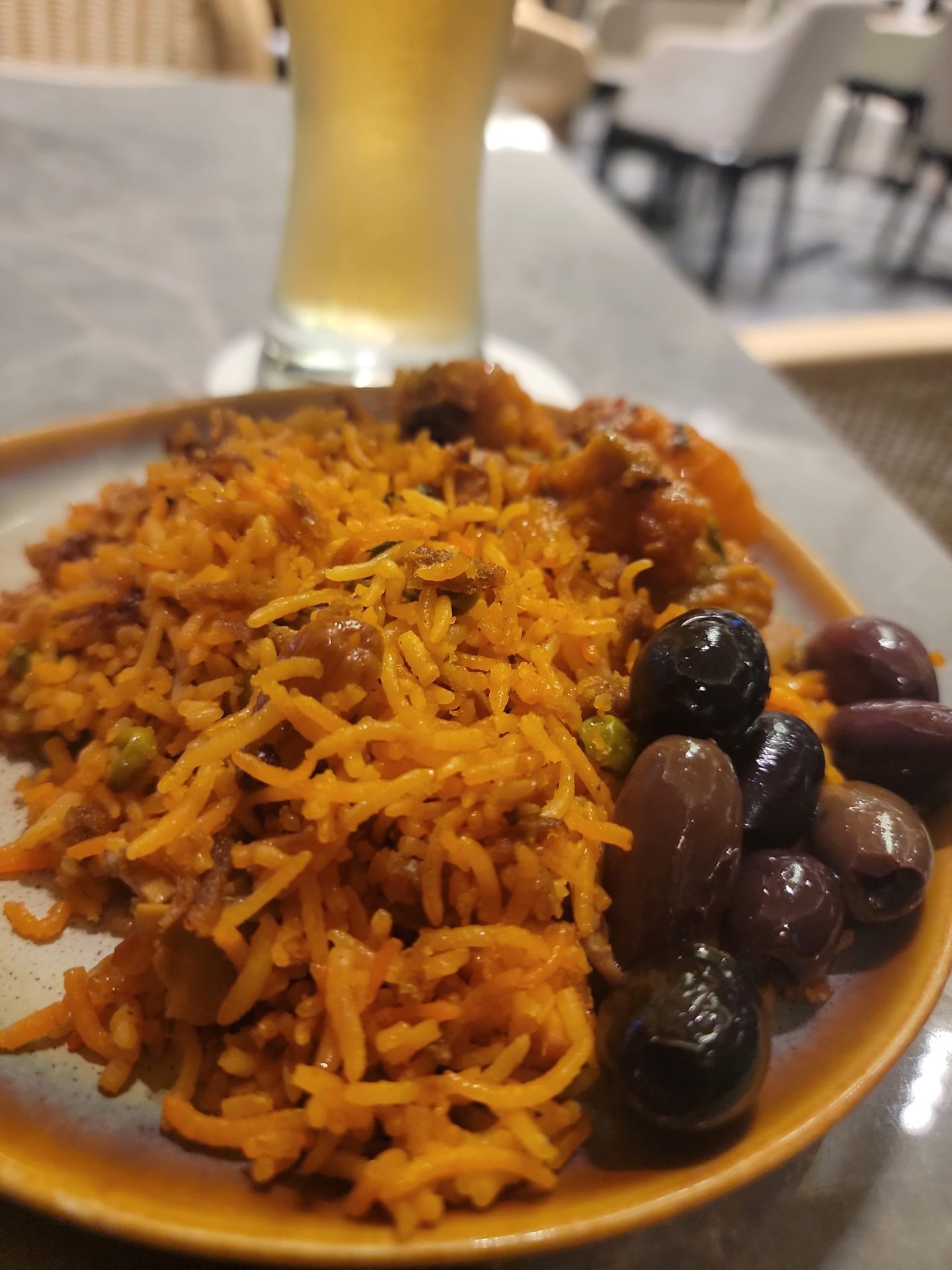 a plate of rice and olives