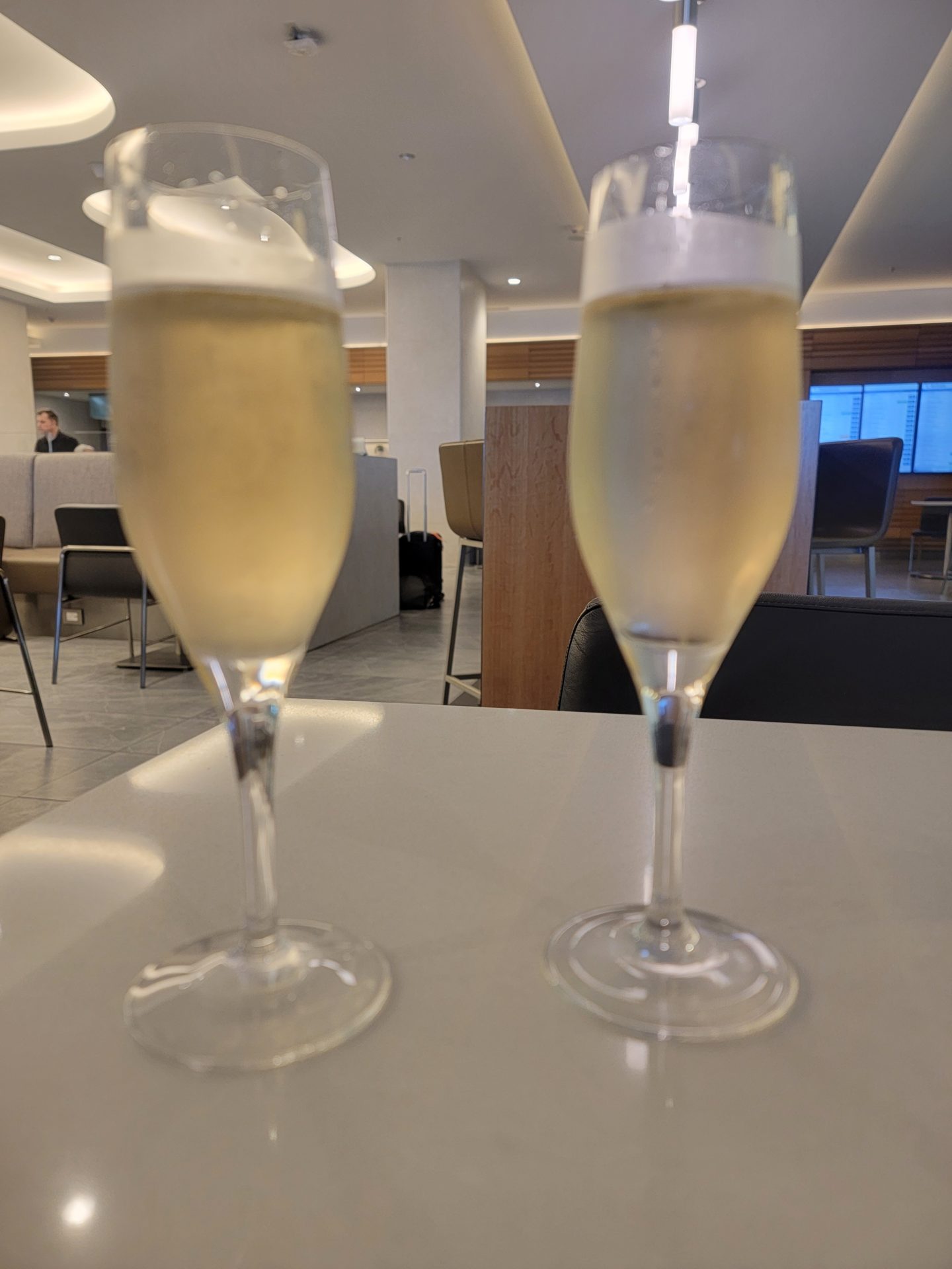 two glasses of champagne on a table