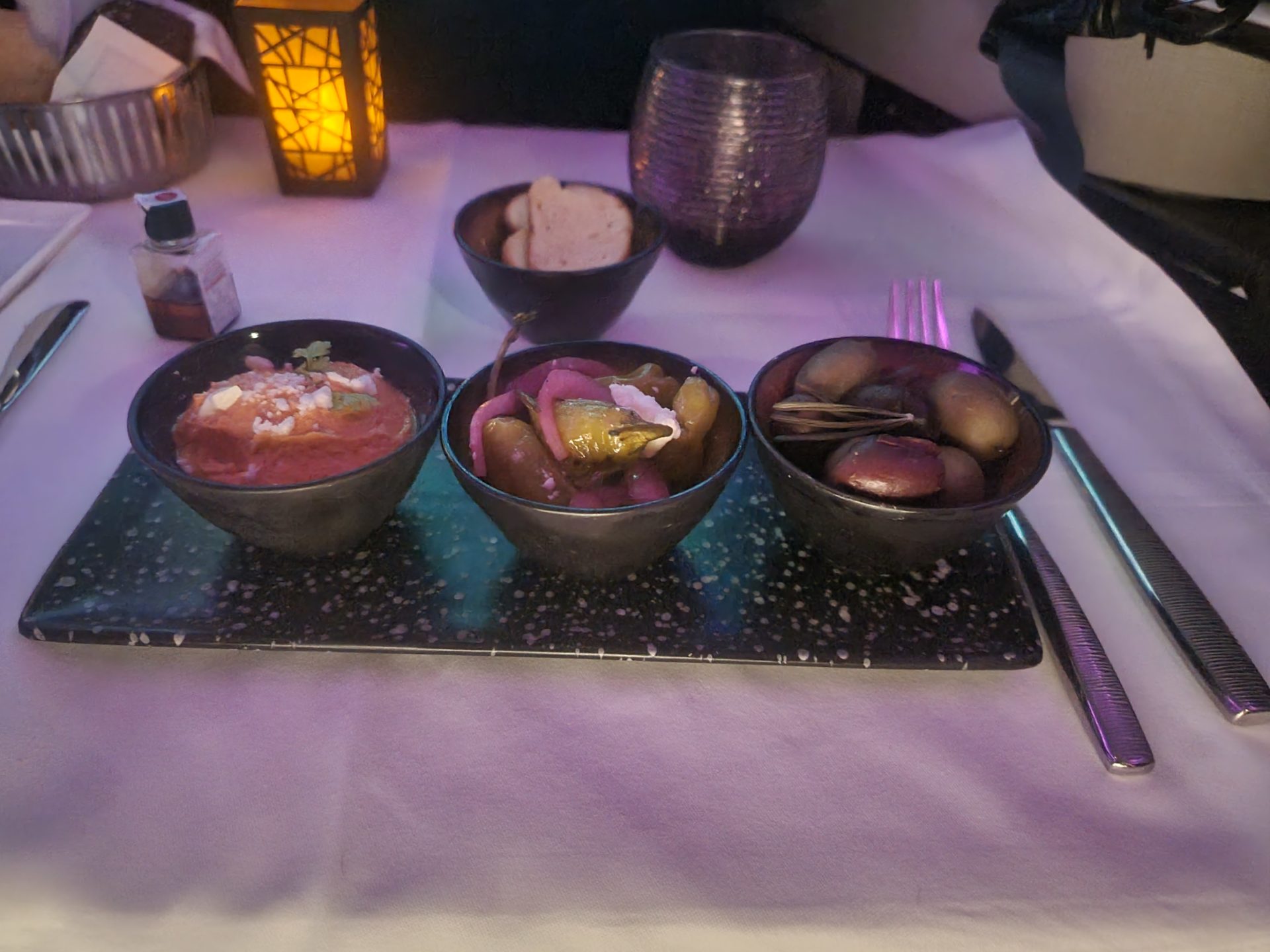 a group of bowls of food on a table