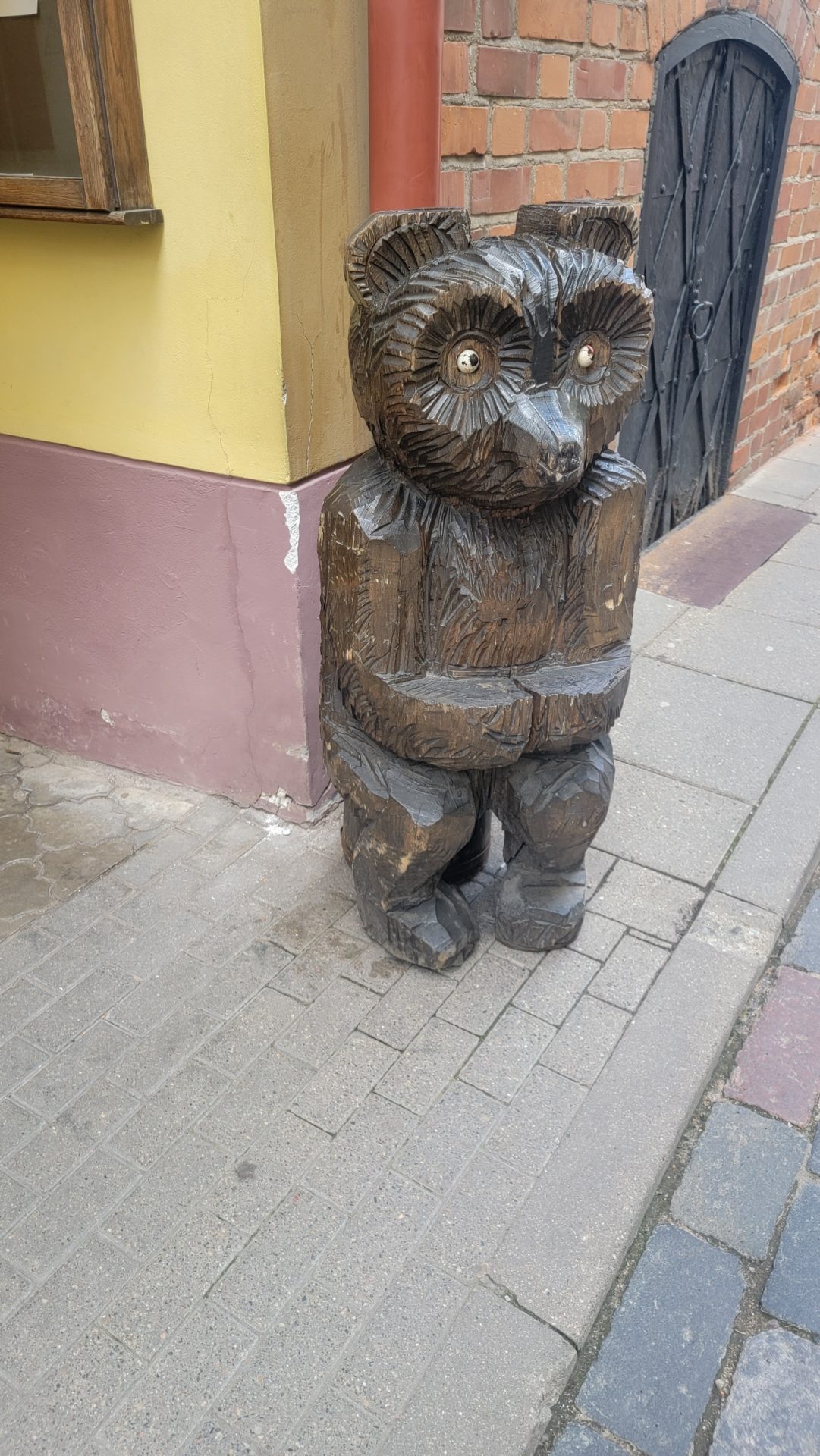 a wooden statue of a bear
