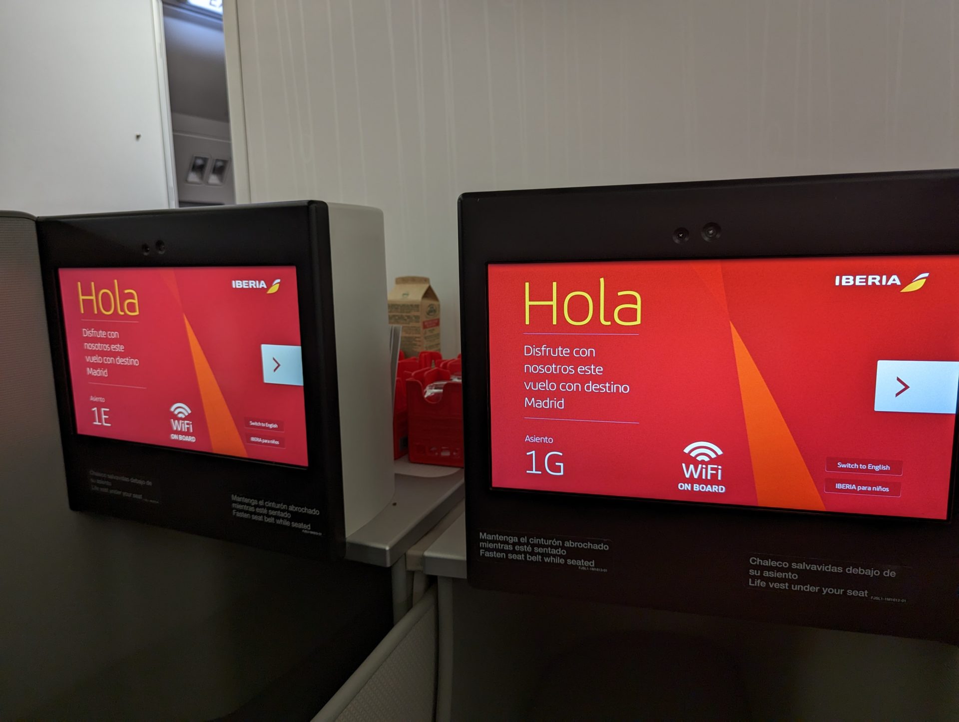 a two black rectangular computers with red and yellow text