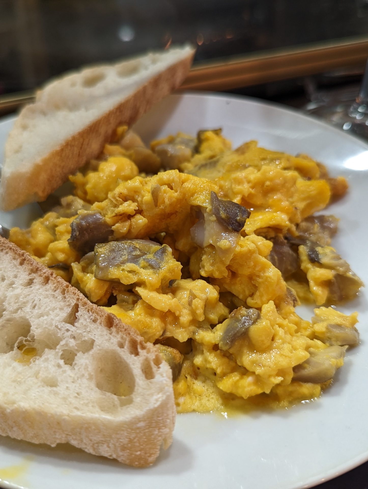 a plate of scrambled eggs and toast