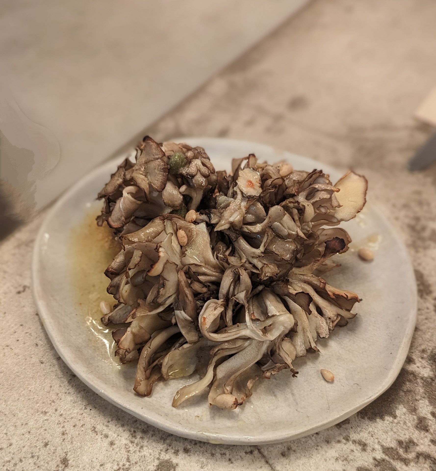 a plate of mushrooms on a counter