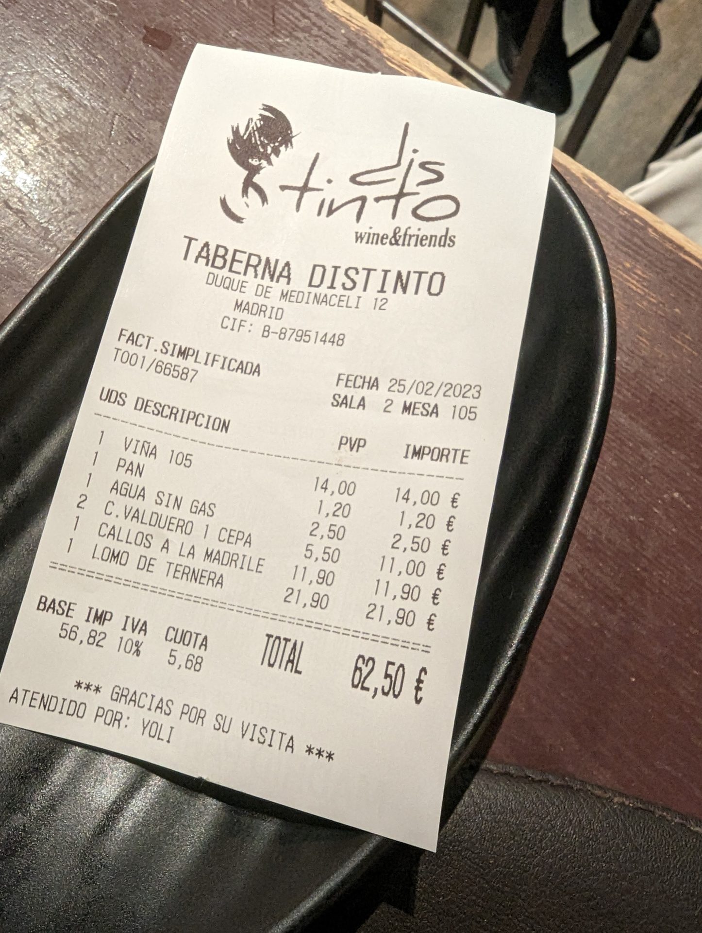 a paper receipt on a plate