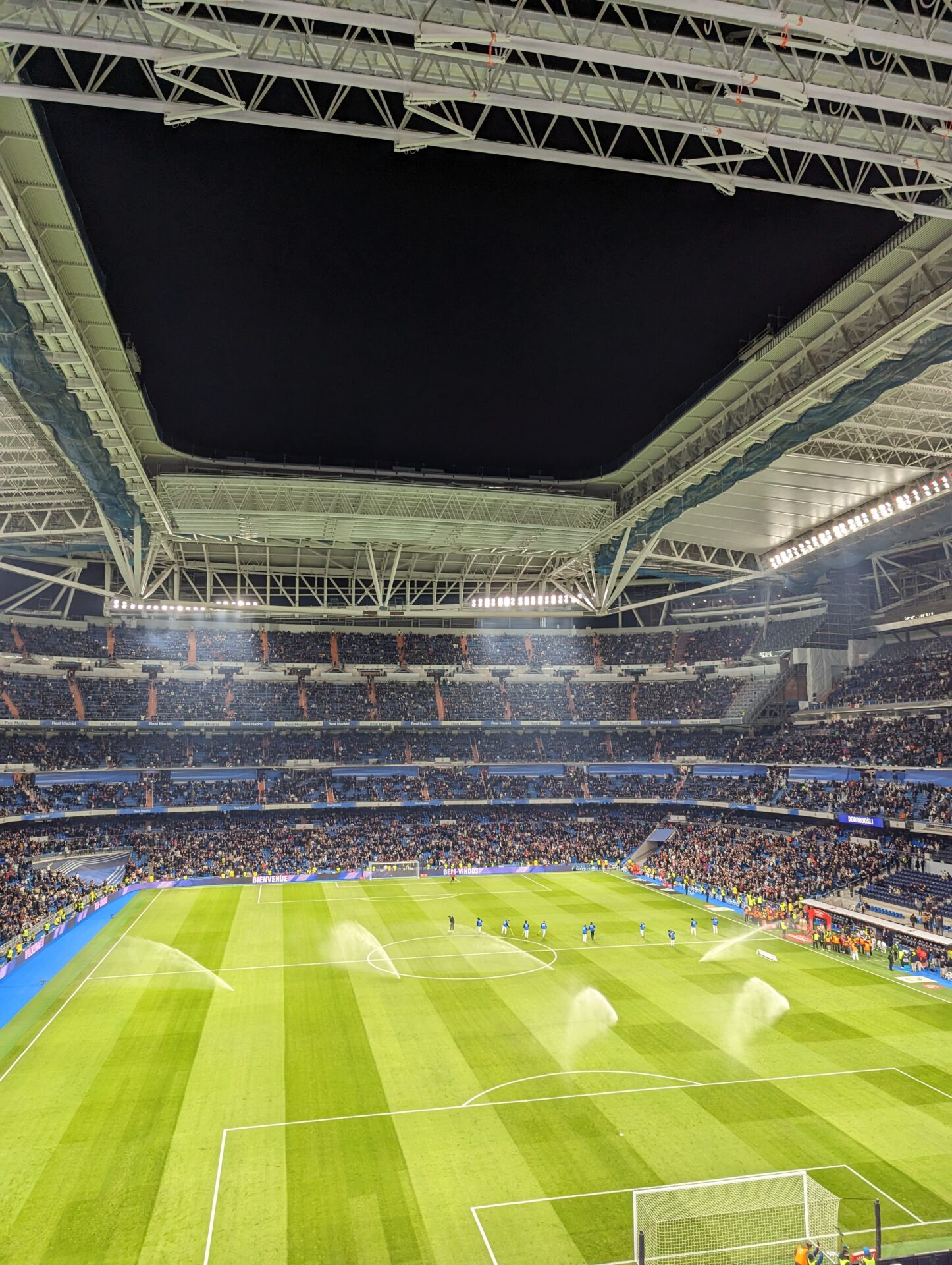 a football stadium with people in the stands