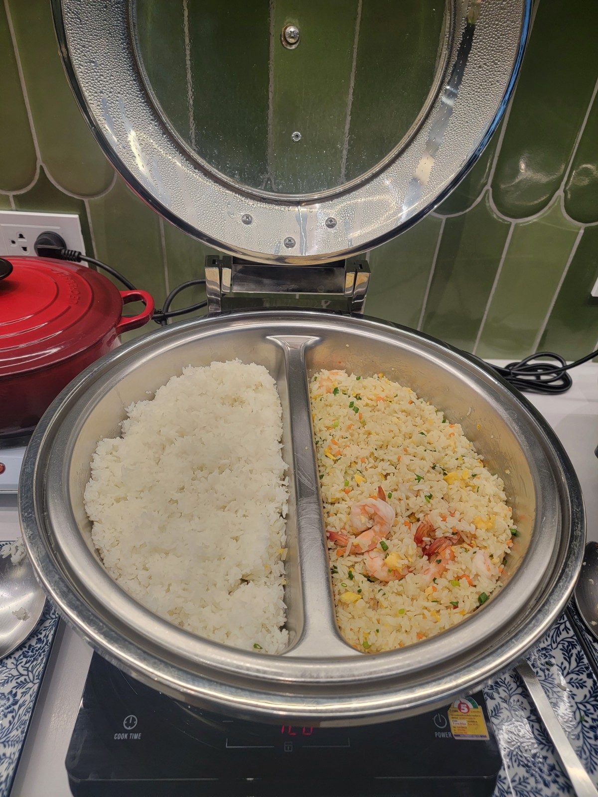 a bowl of rice and shrimp on a stove