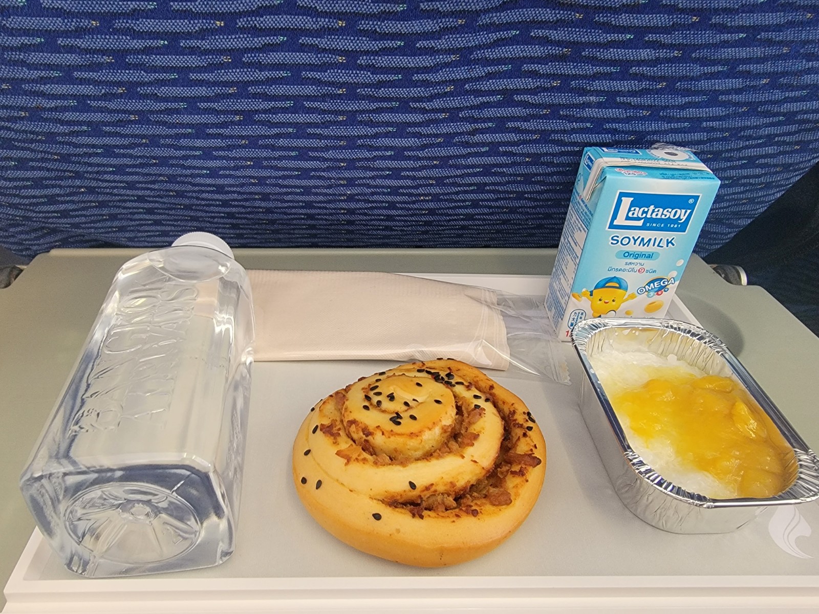 a tray with food and a bottle of milk