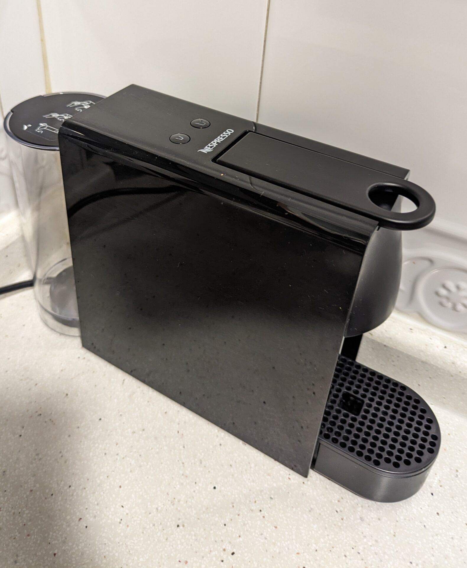 a black coffee maker on a counter