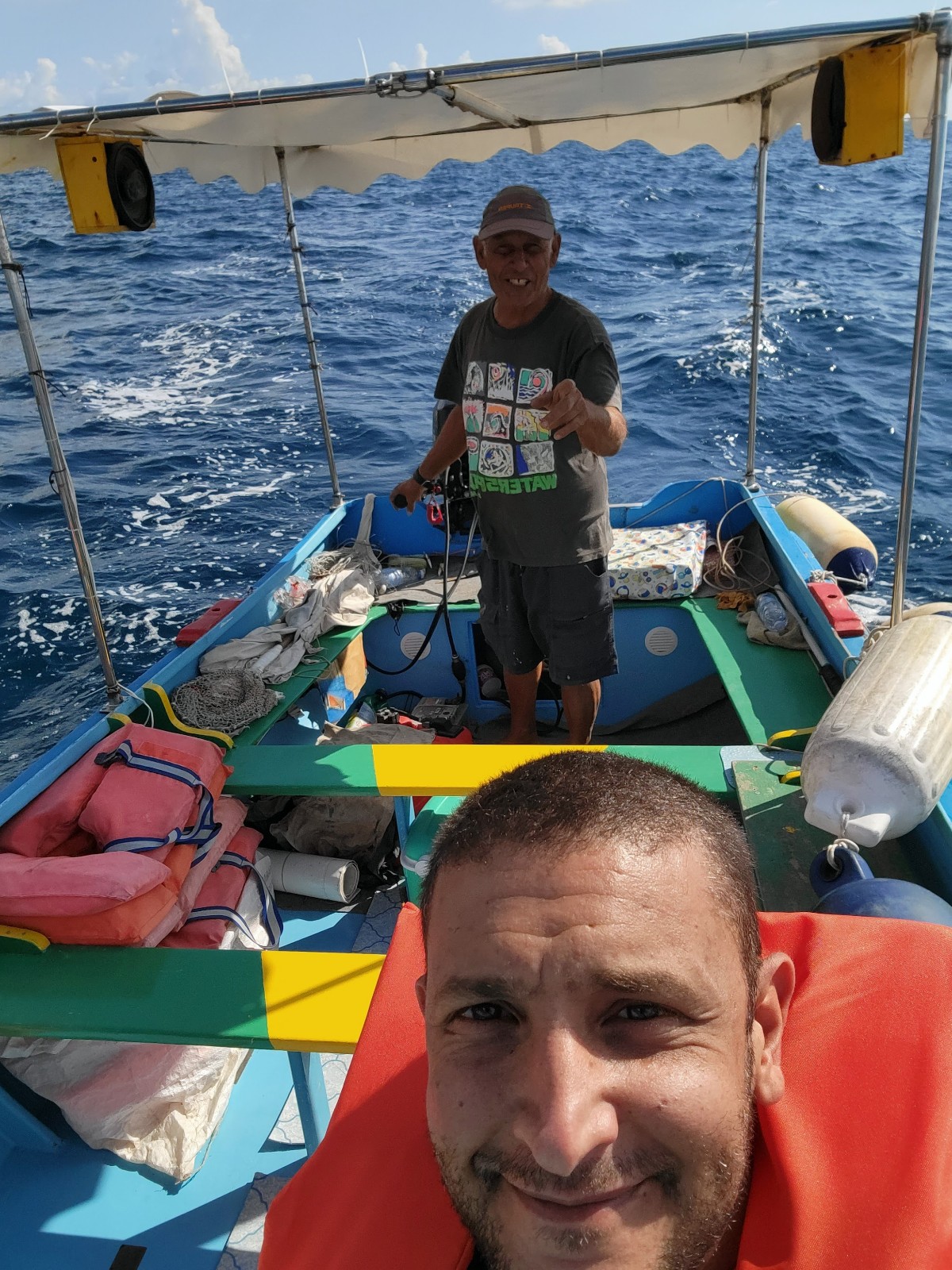 a man taking a selfie on a boat