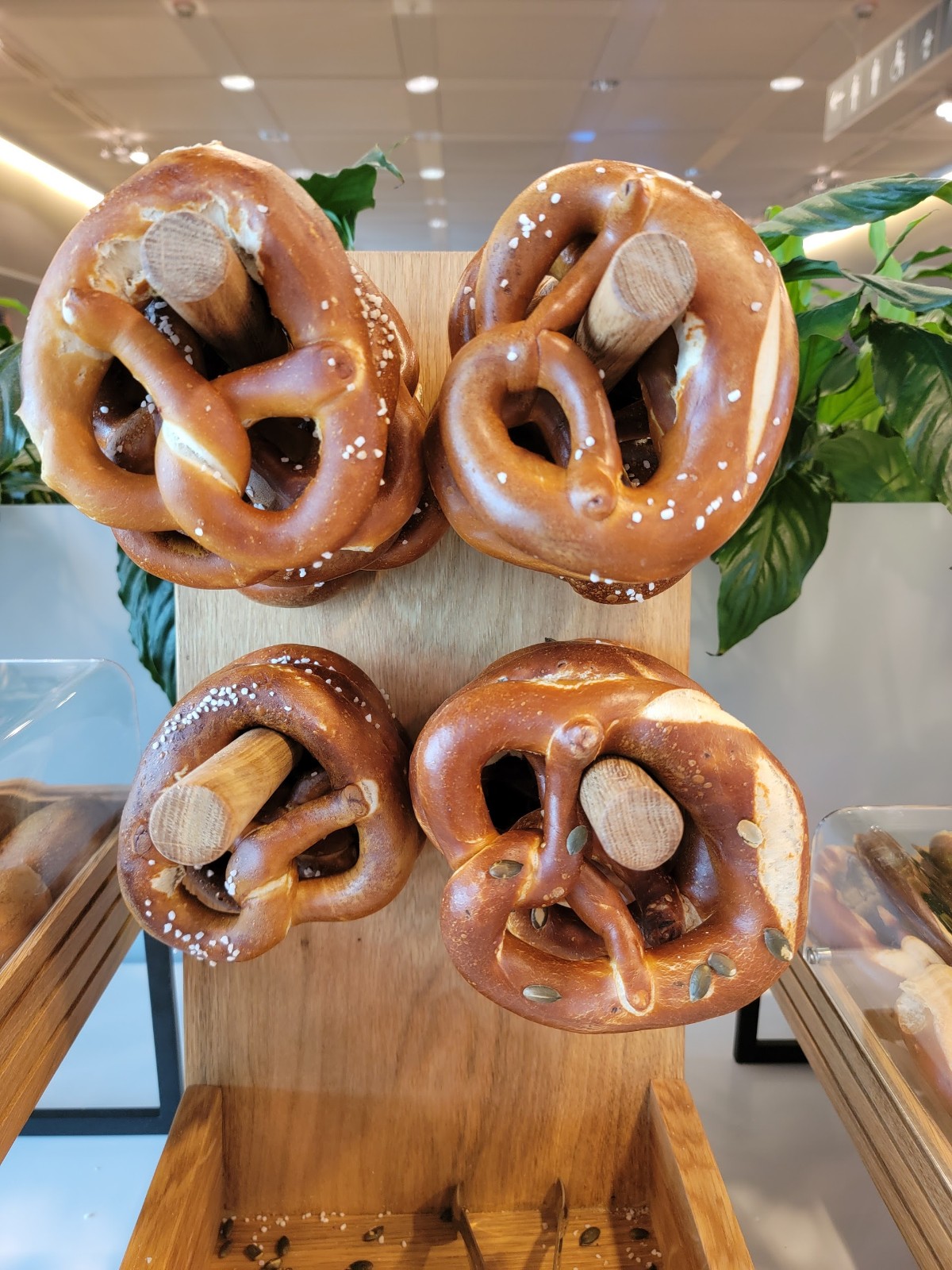 a group of pretzels on a wood board