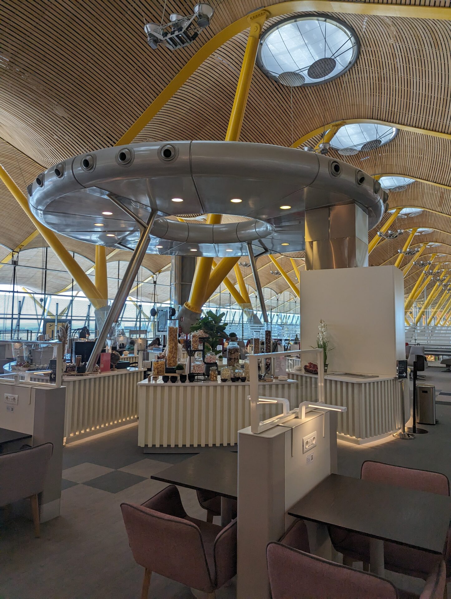 a food court with a large round object