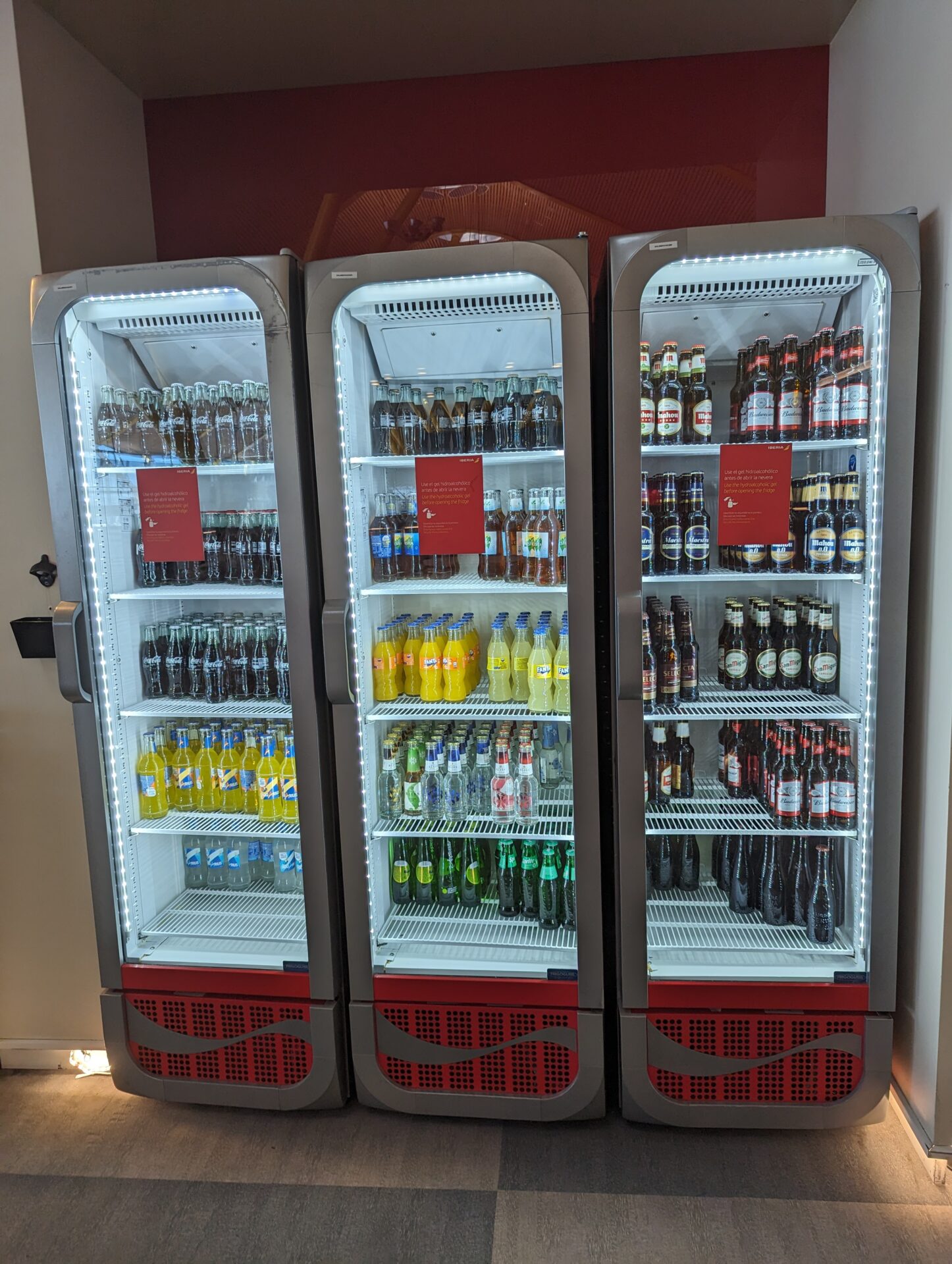 a refrigerator with drinks on shelves