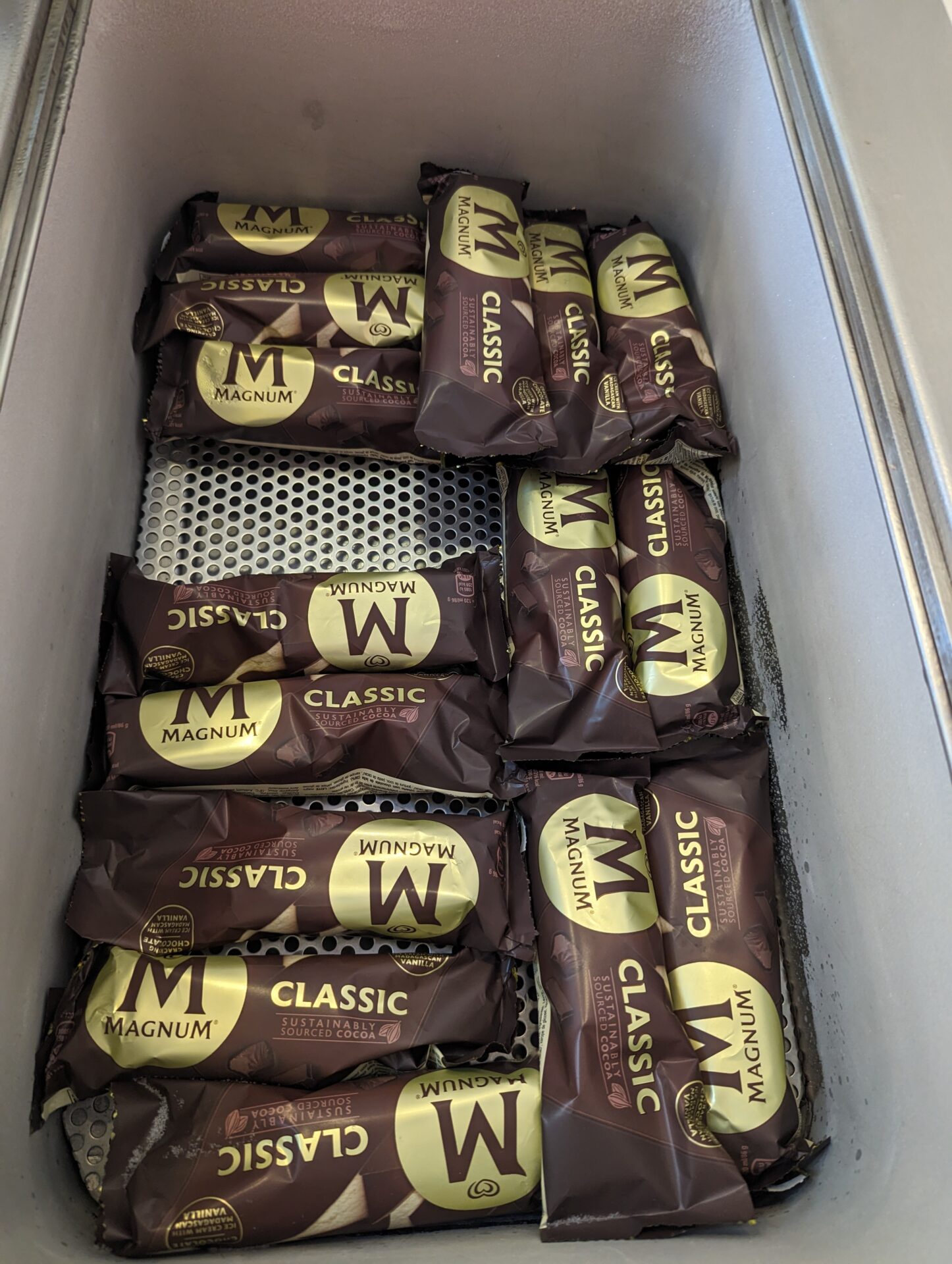 a group of packages of chocolate bars in a freezer