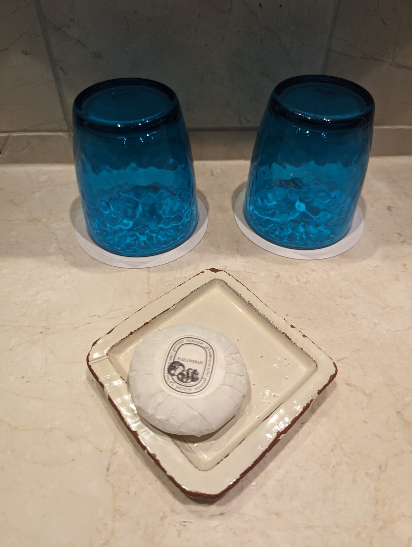 two blue glasses on a plate