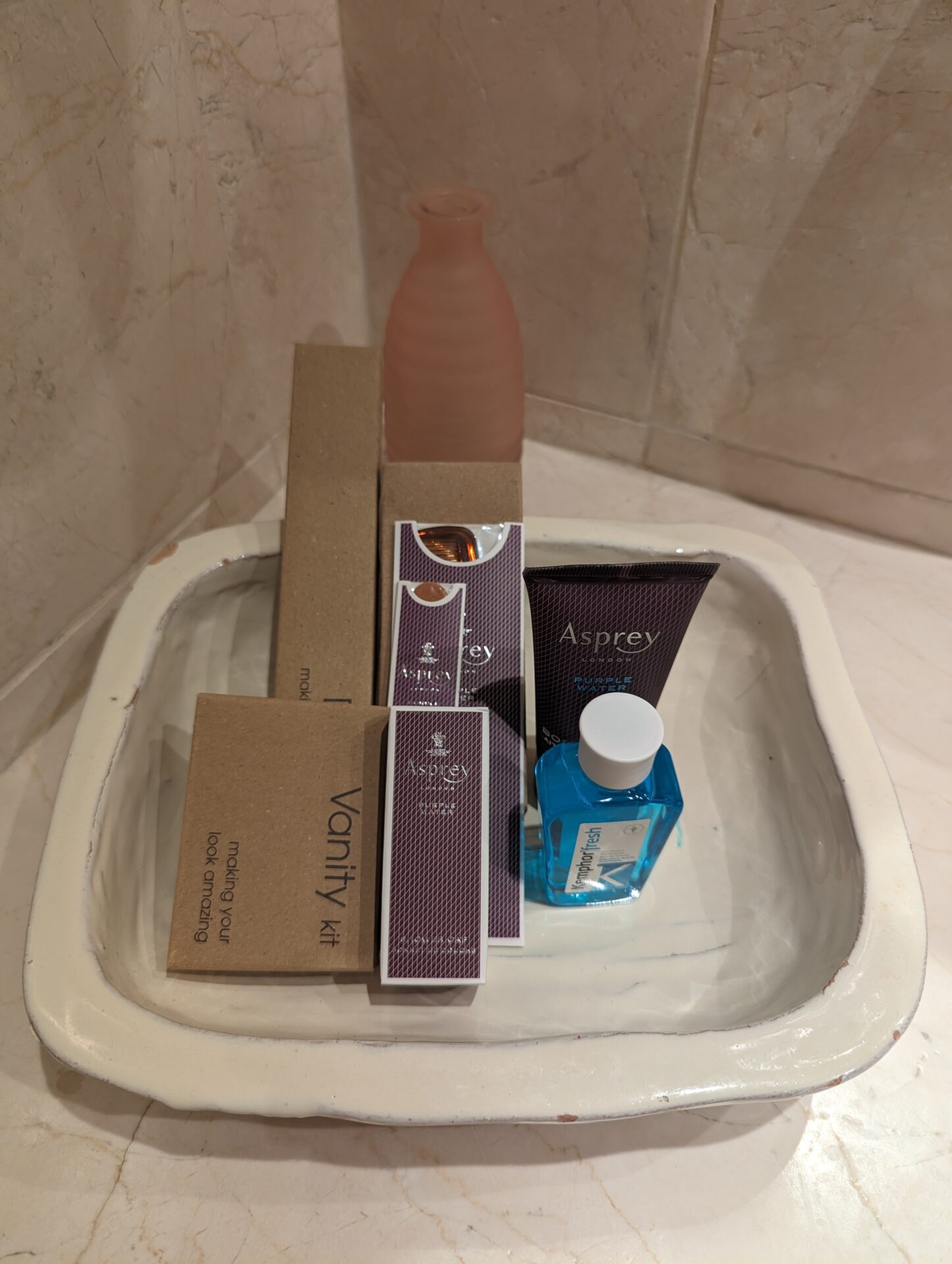a tray of toiletries and a bottle