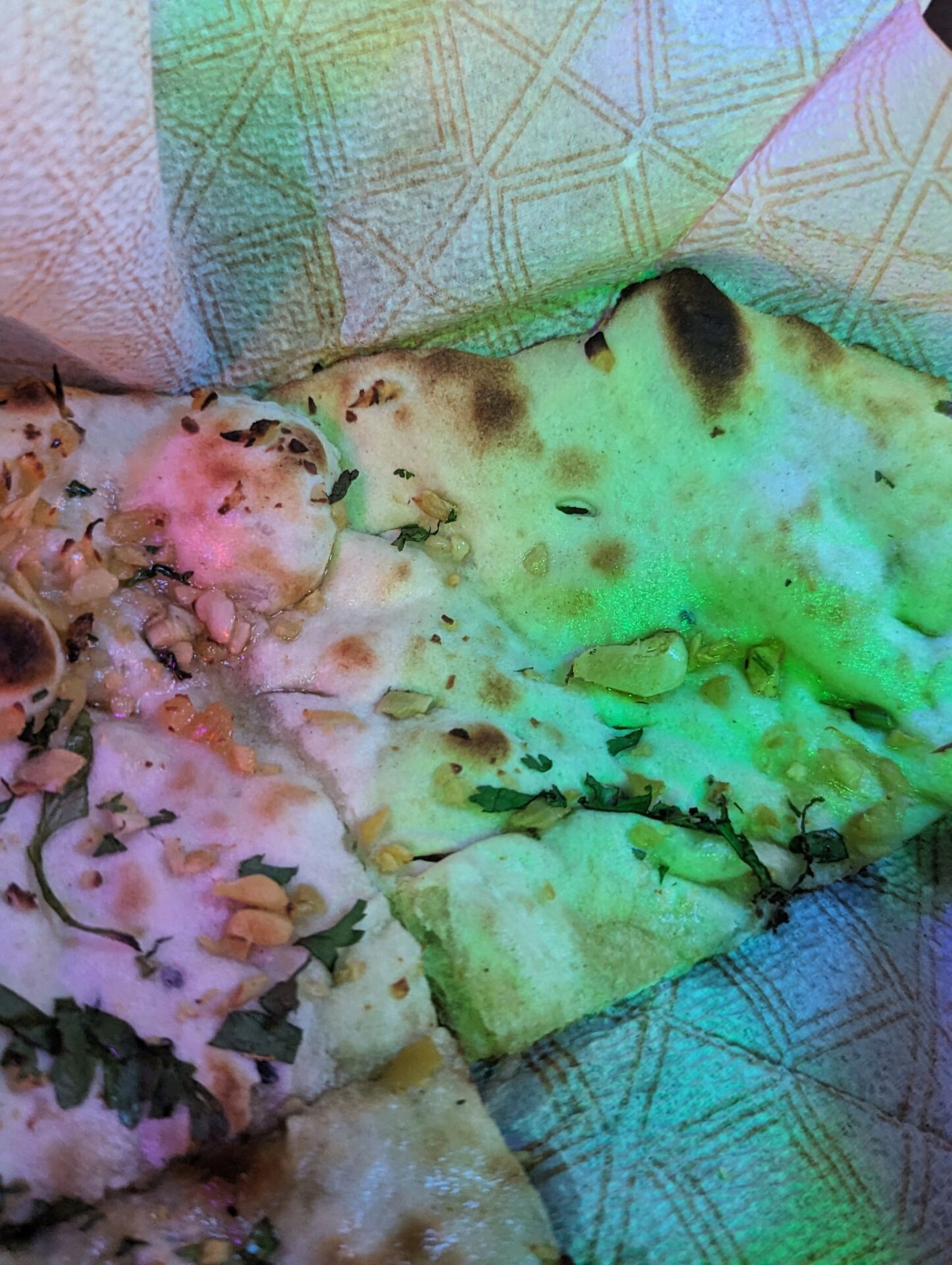 a pizza with green light