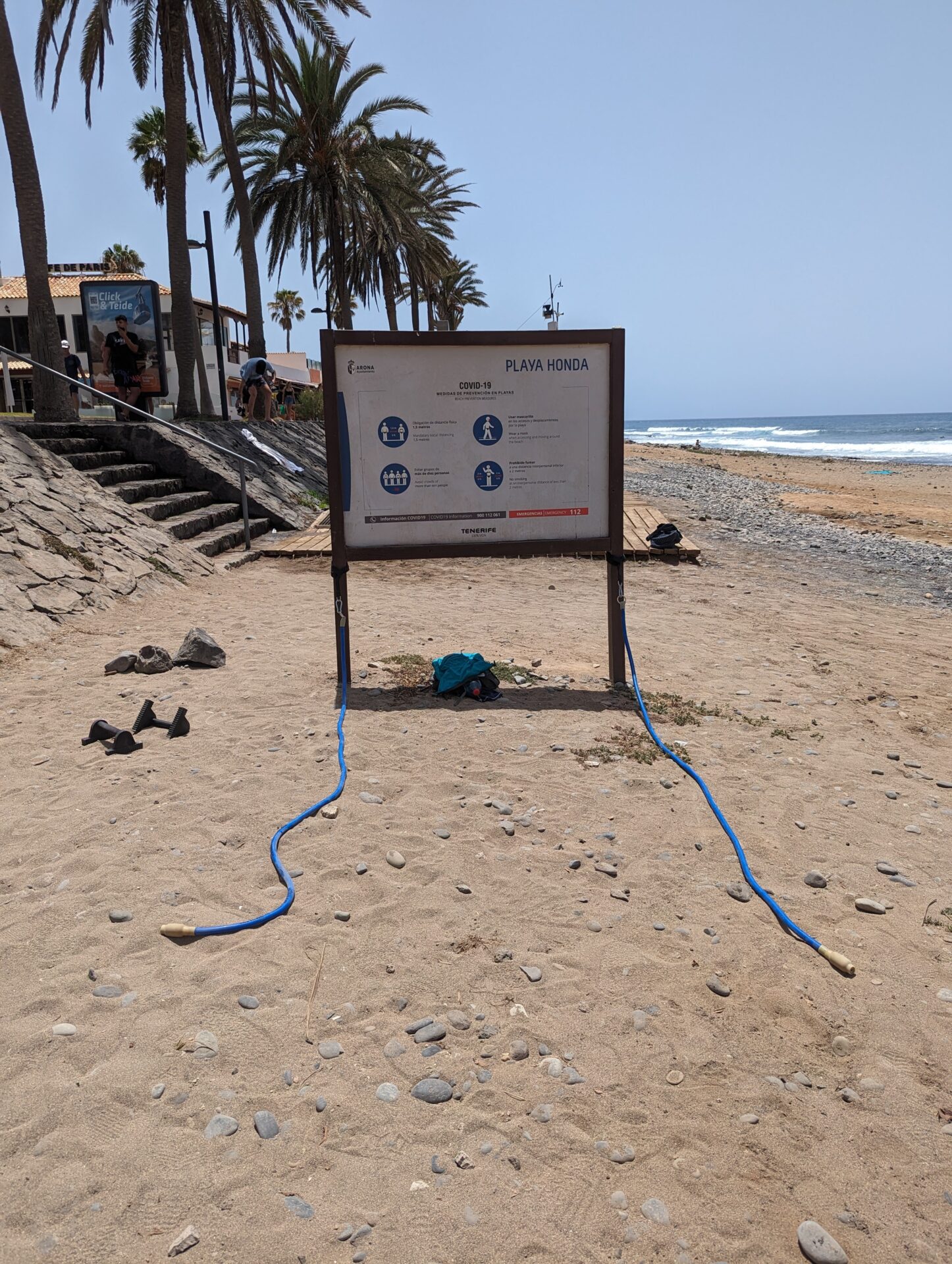 a sign on a beach