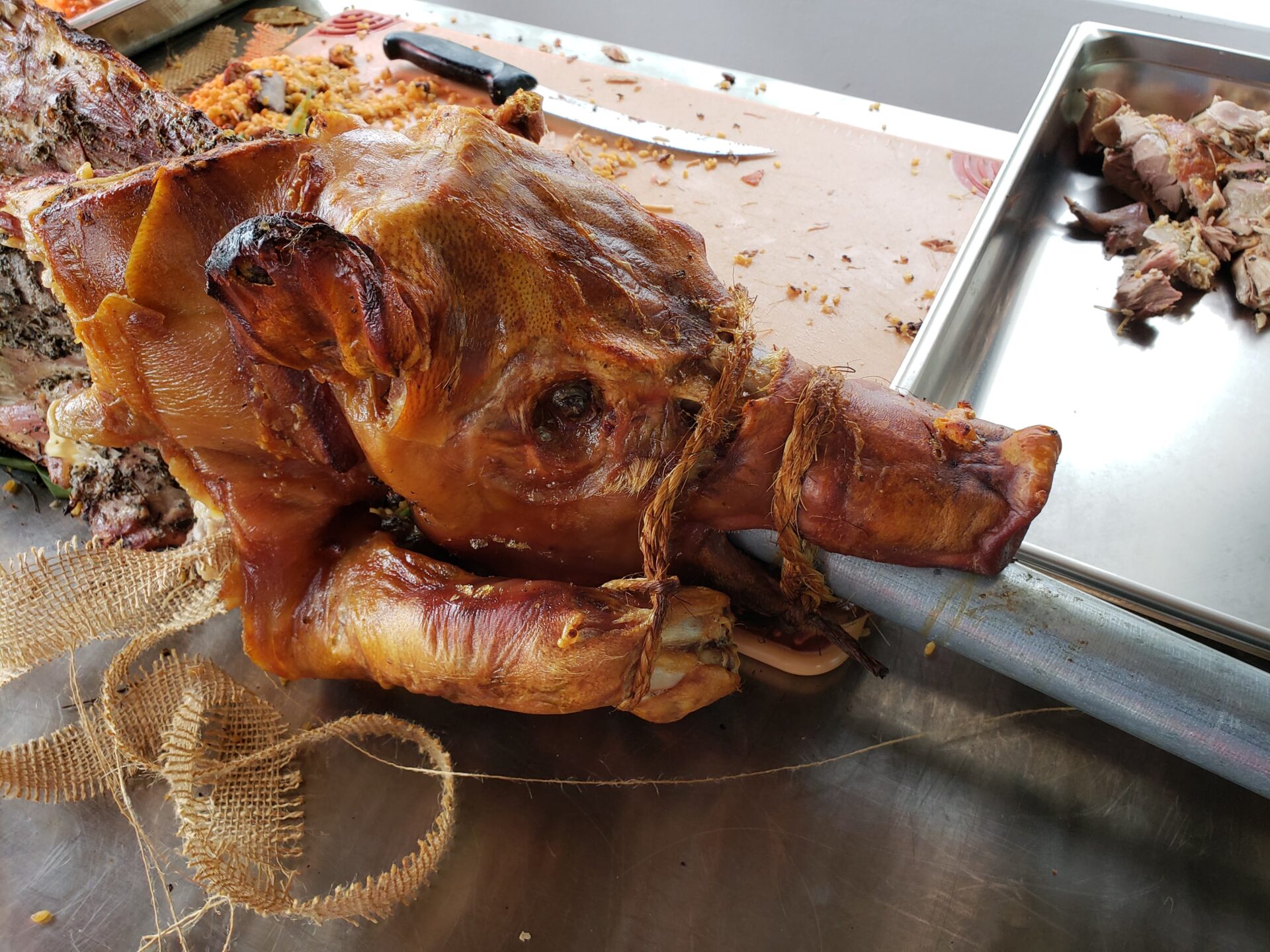 a roasted pig on a metal pole