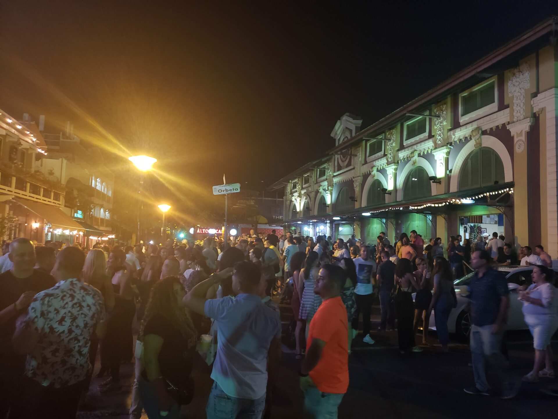 a crowd of people outside at night