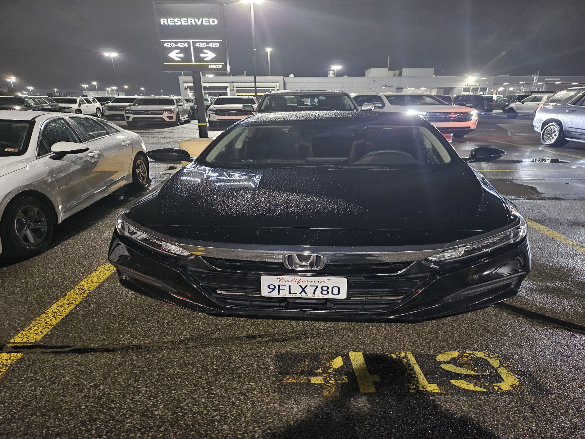 a black car parked in a parking lot