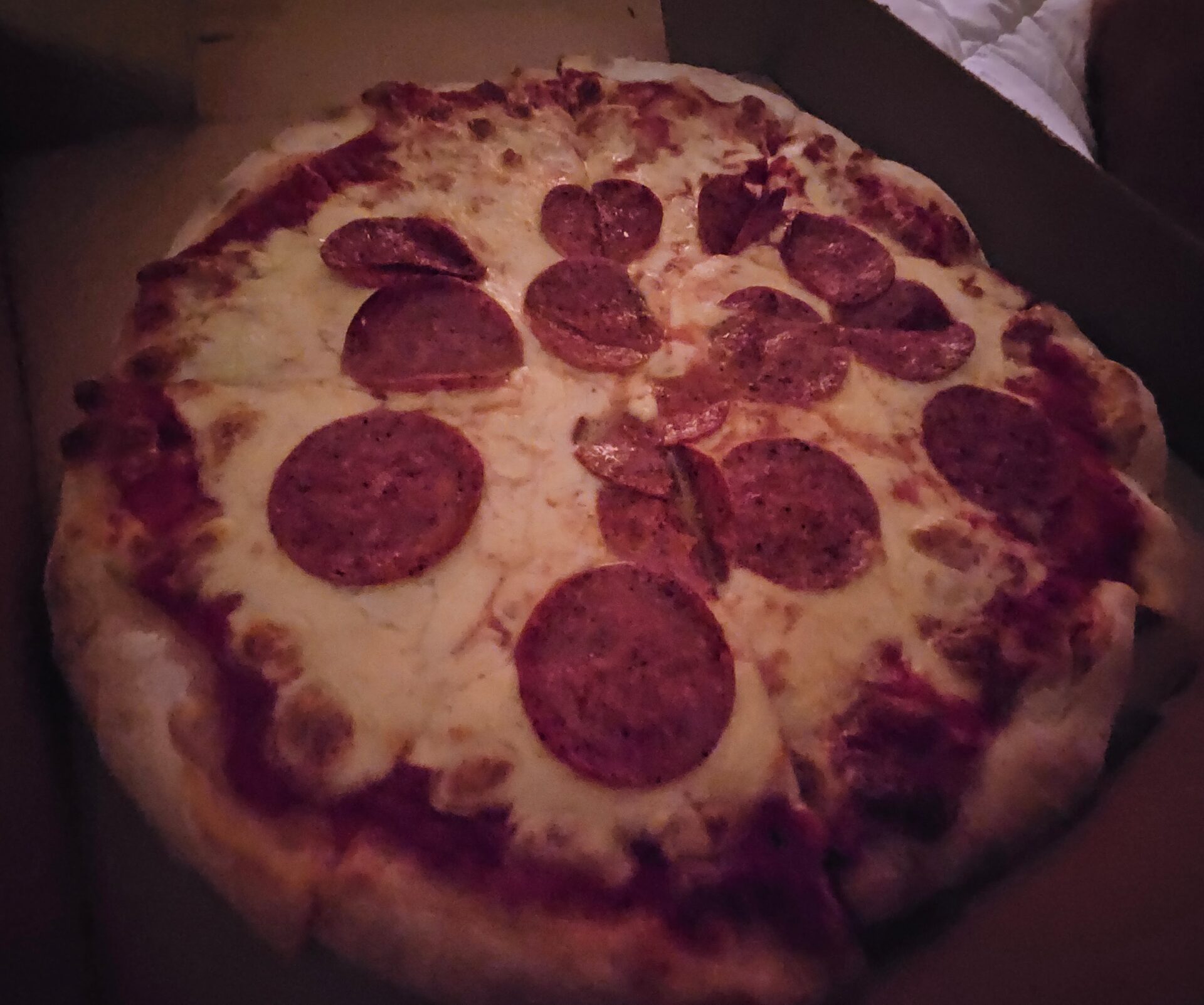 a pepperoni pizza in a box