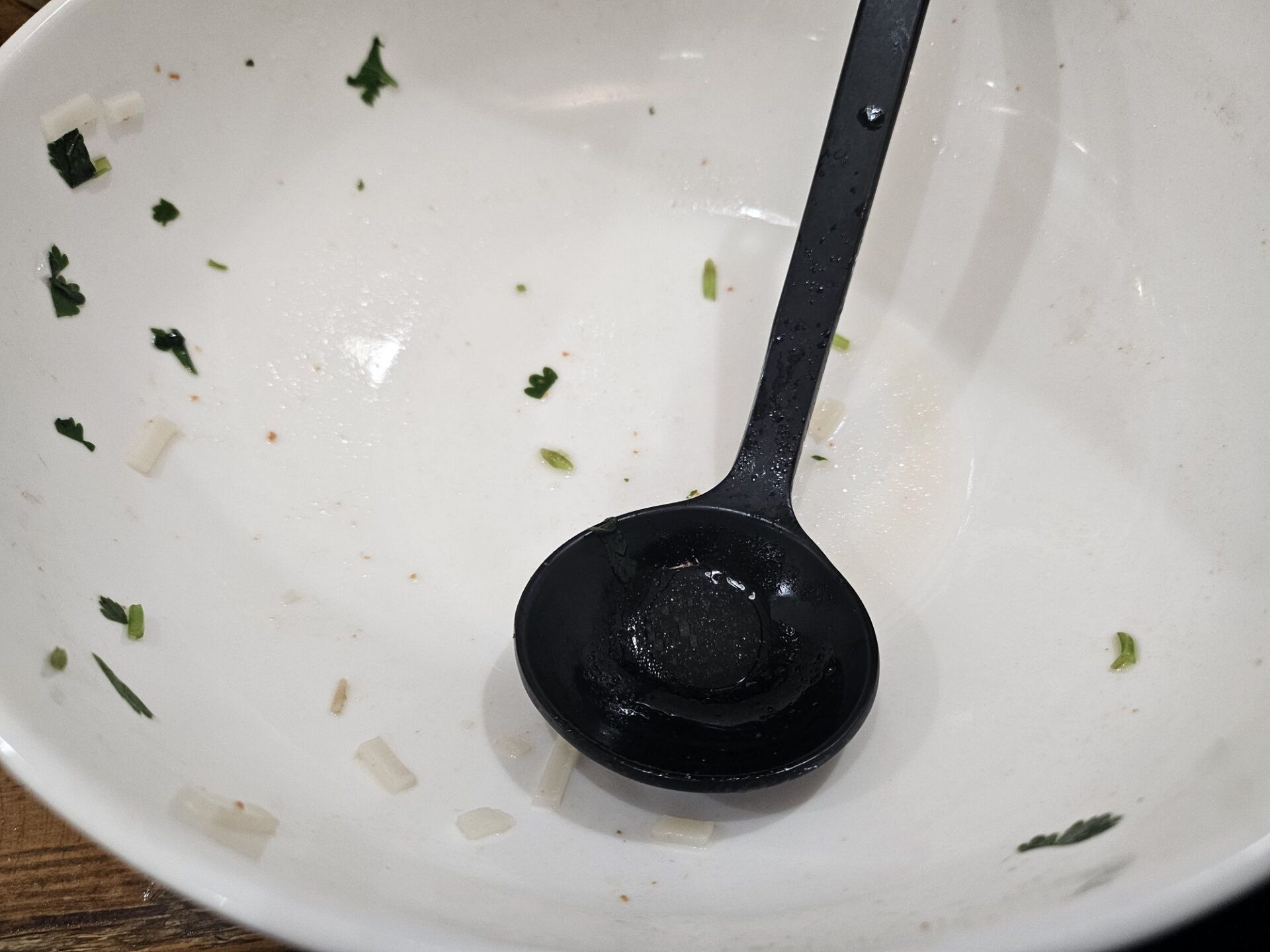 a black spoon in a bowl