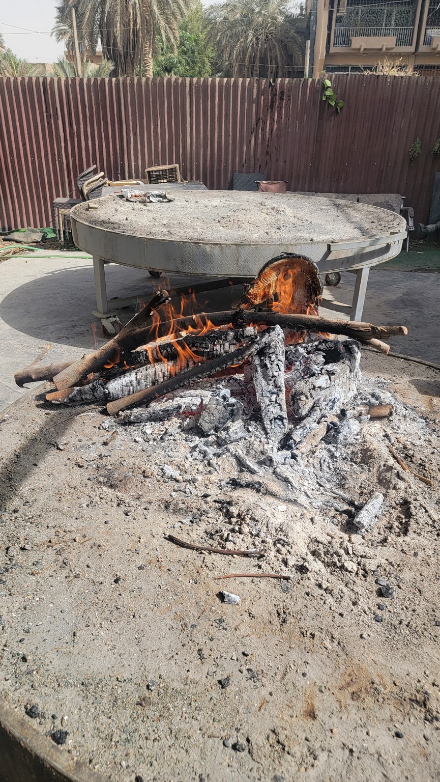 a fire pit with a round table