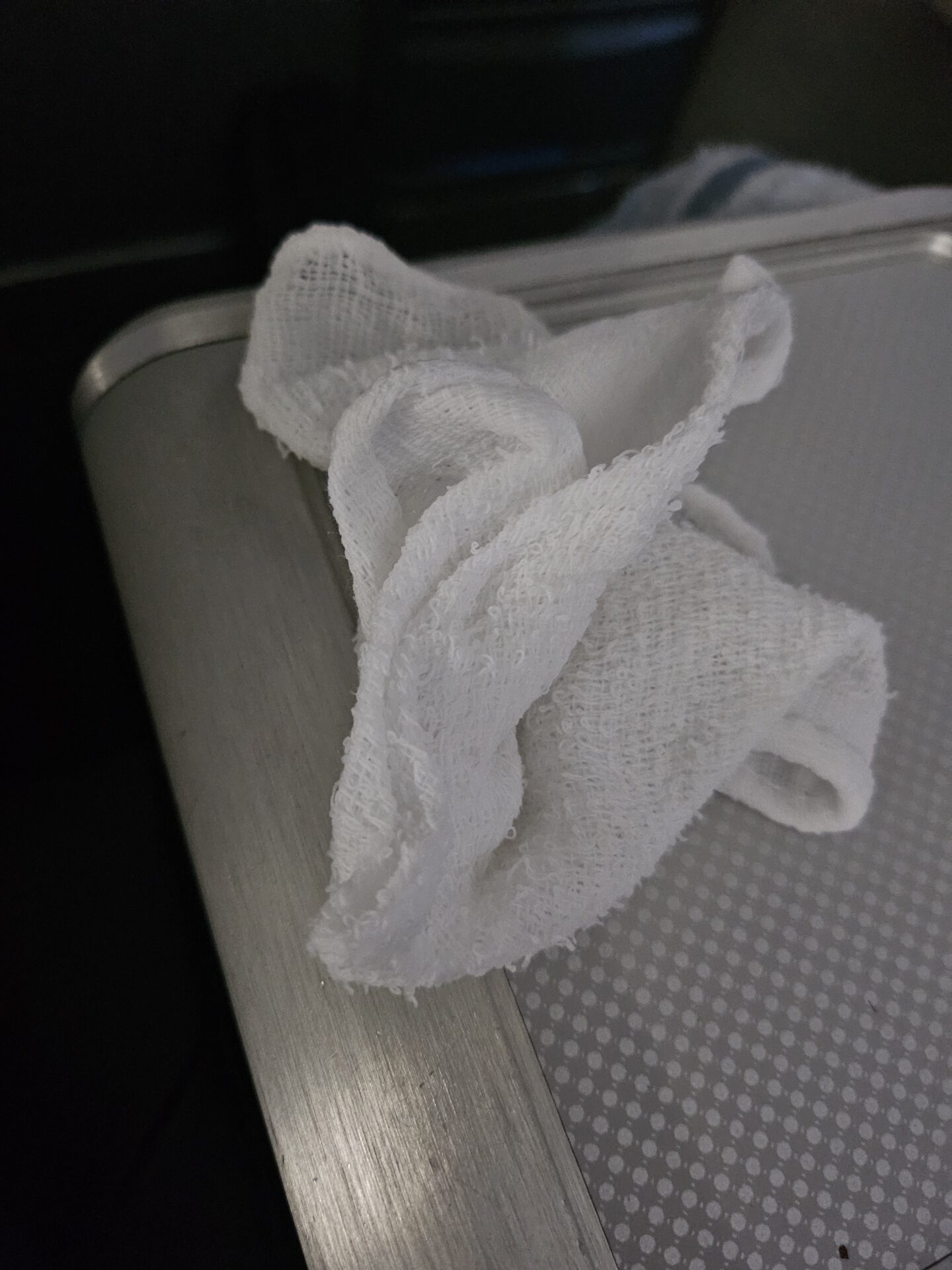 a white towel on a metal box