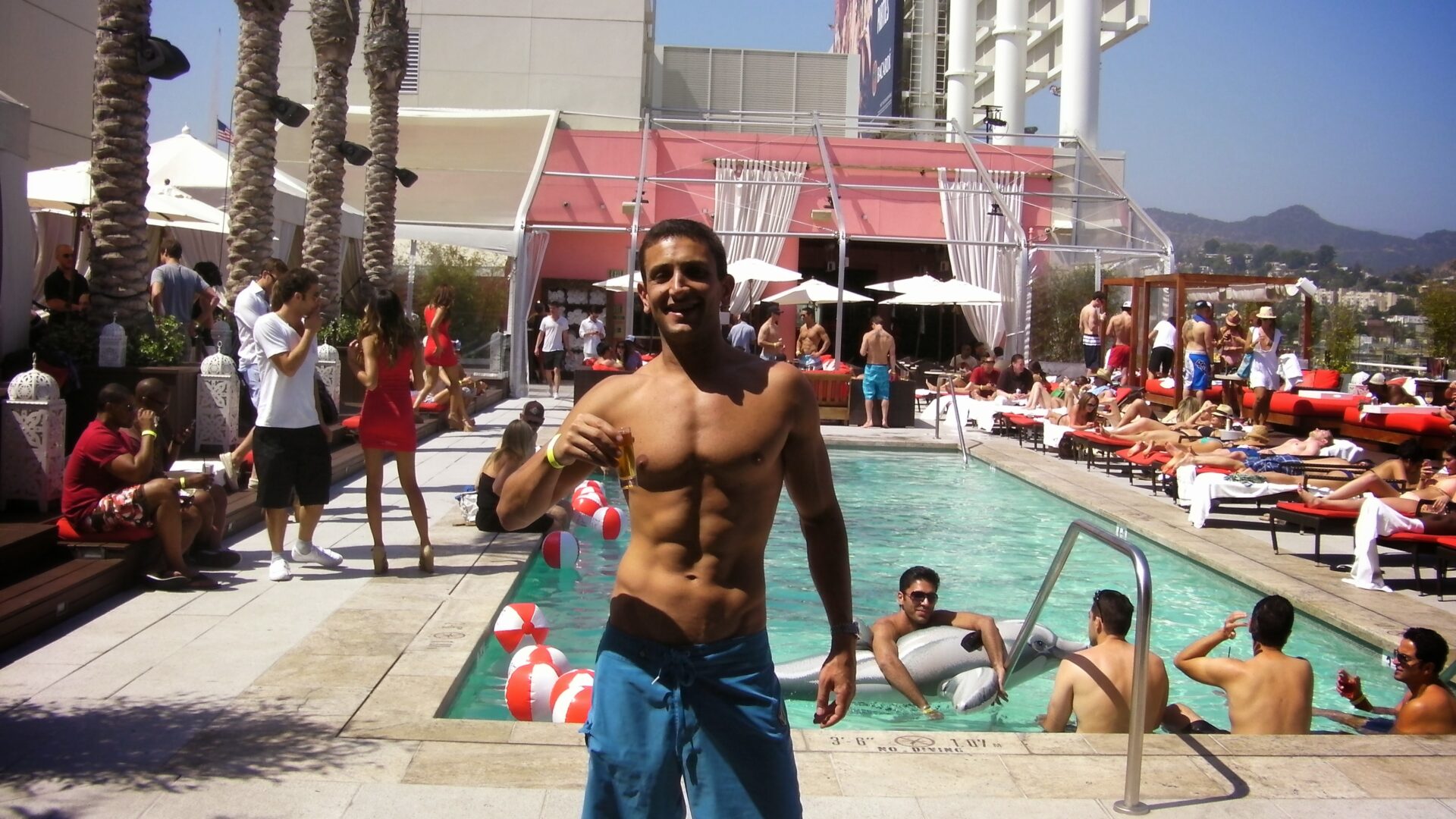 a man standing in front of a pool