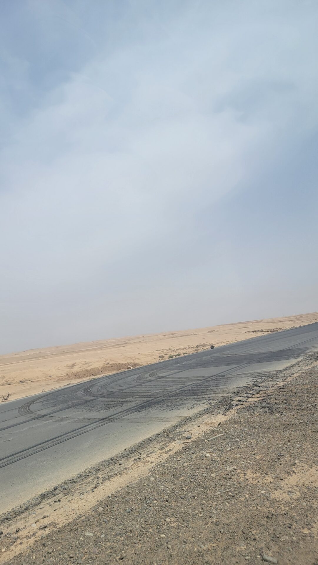 a road with tire tracks on it