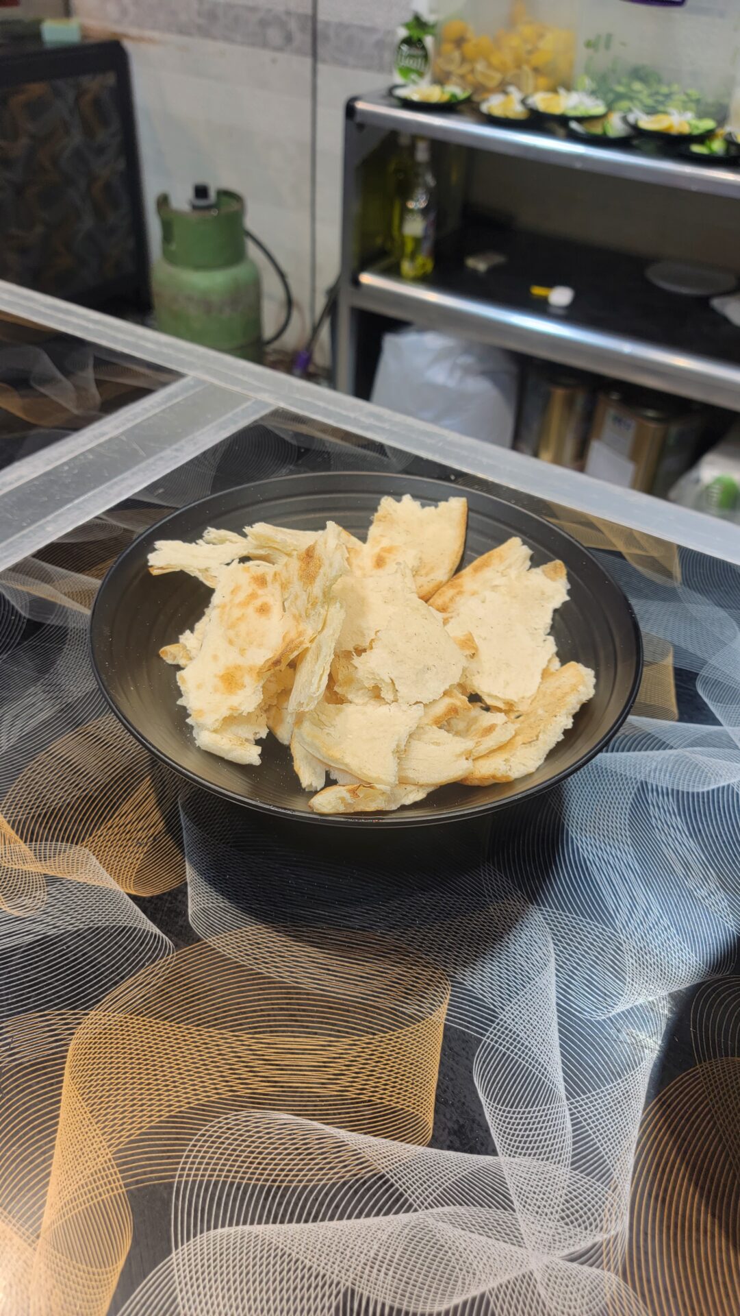 a bowl of bread on a table