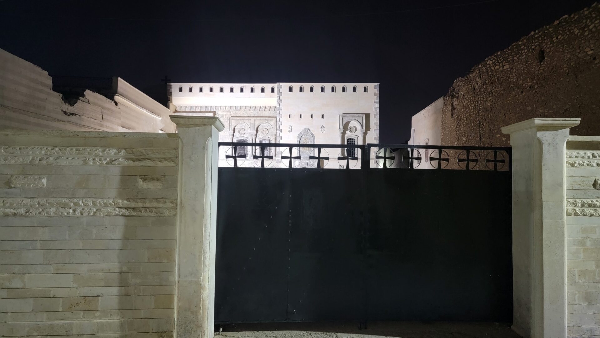 a building with a black gate