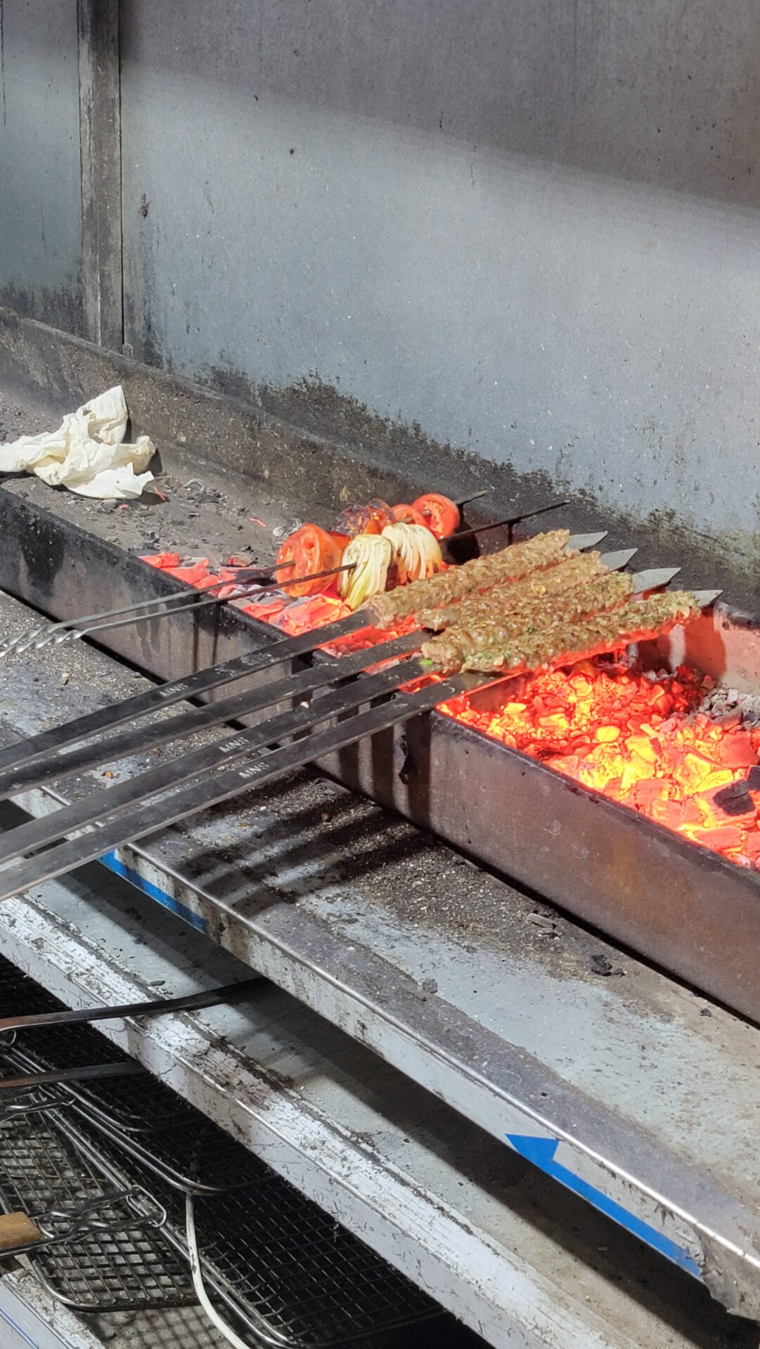 skewers being cooked on a grill