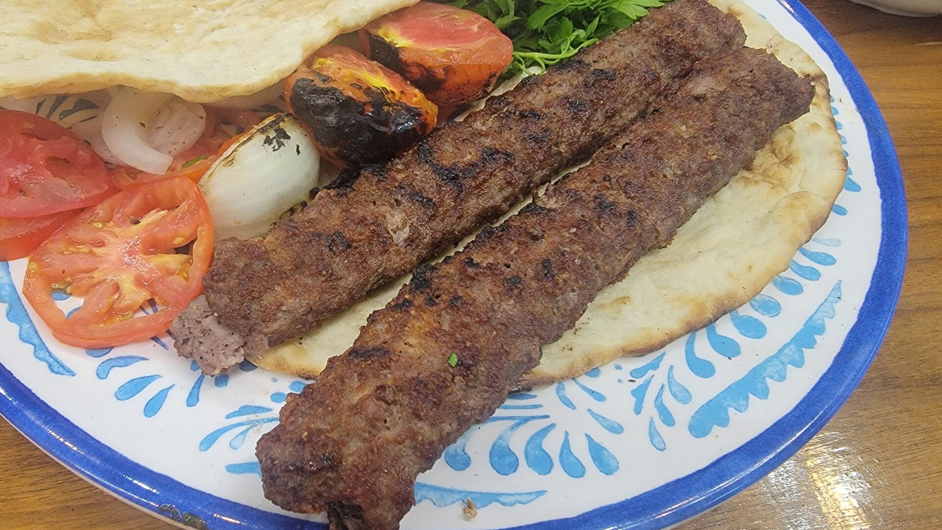 a plate of food with meat and vegetables