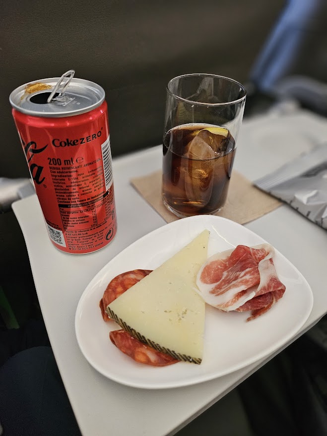 a plate of food and a drink on a table