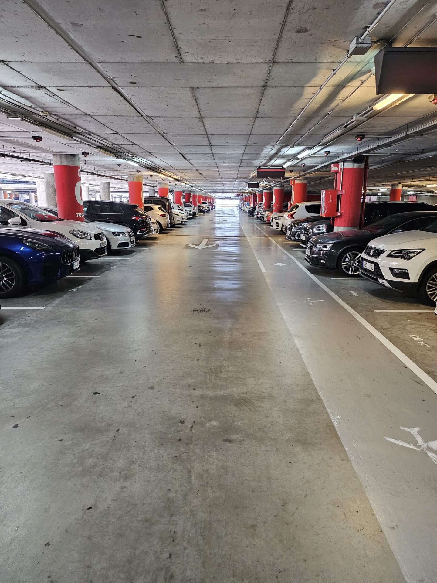 a parking garage with many cars