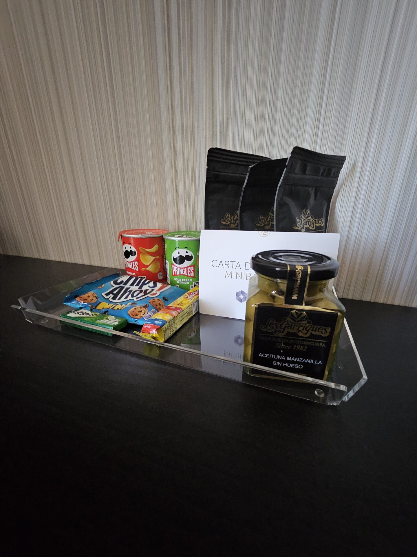 a glass tray with food and snacks on it