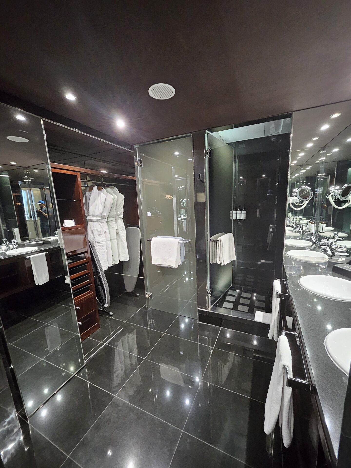 a bathroom with mirrors and sinks